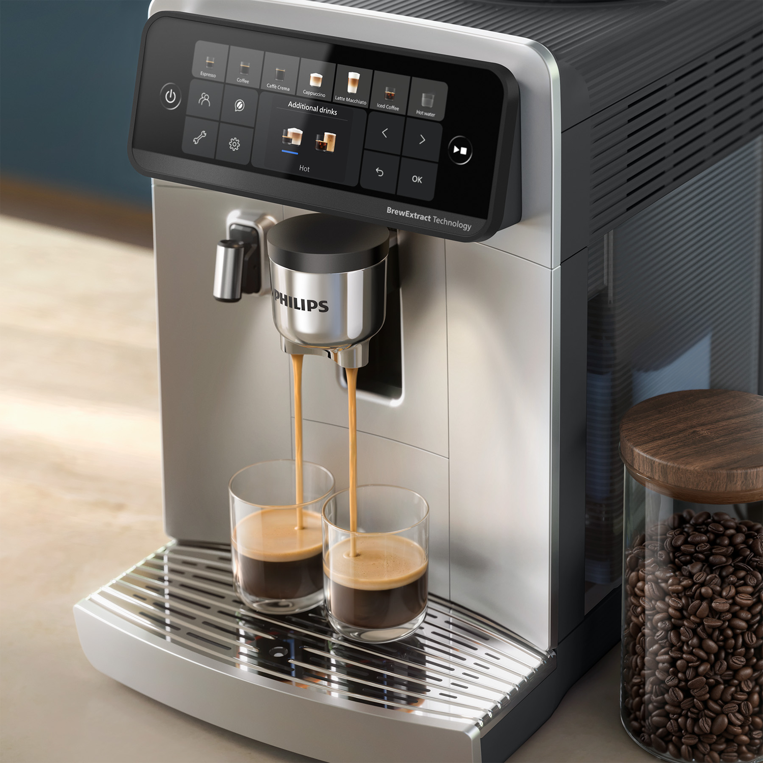Philips coffee machine dispensing espresso into two glasses, with a jar of coffee beans on the right.