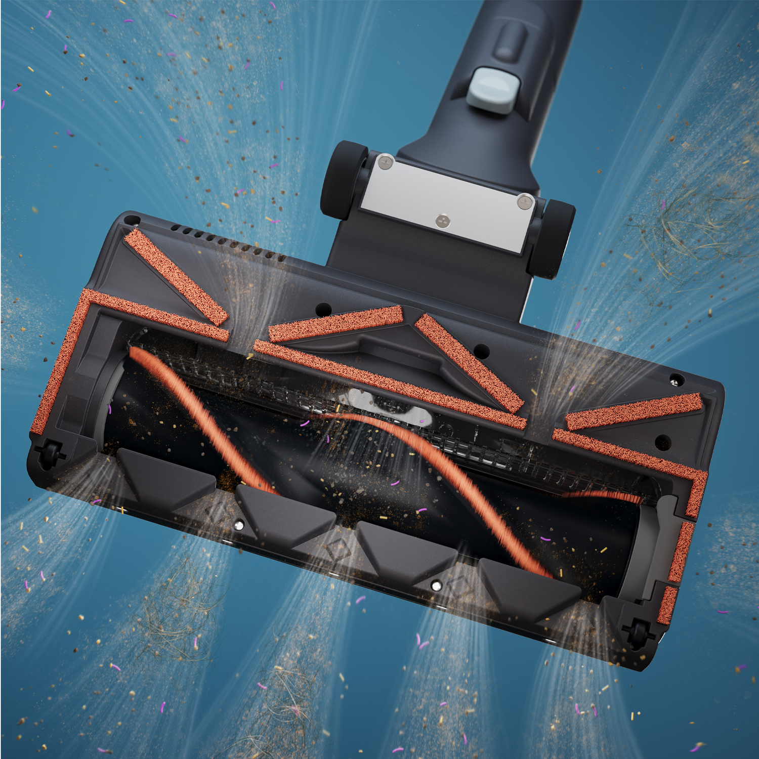 Bottom view of a gray vacuum cleaner nozzle with rotating orange brushes pulling in dust and hair on a blue background.