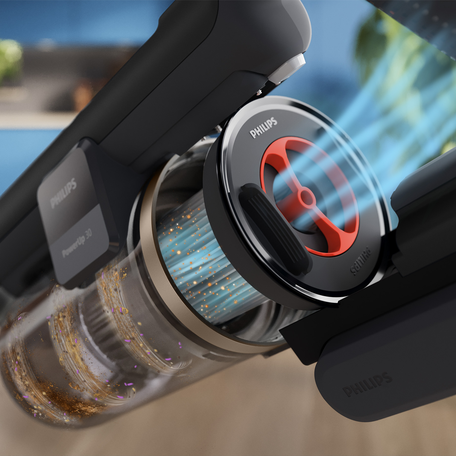 Close-up of a Philips vacuum cleaner nozzle showing blue air currents and dirt swirling in the transparent bin.