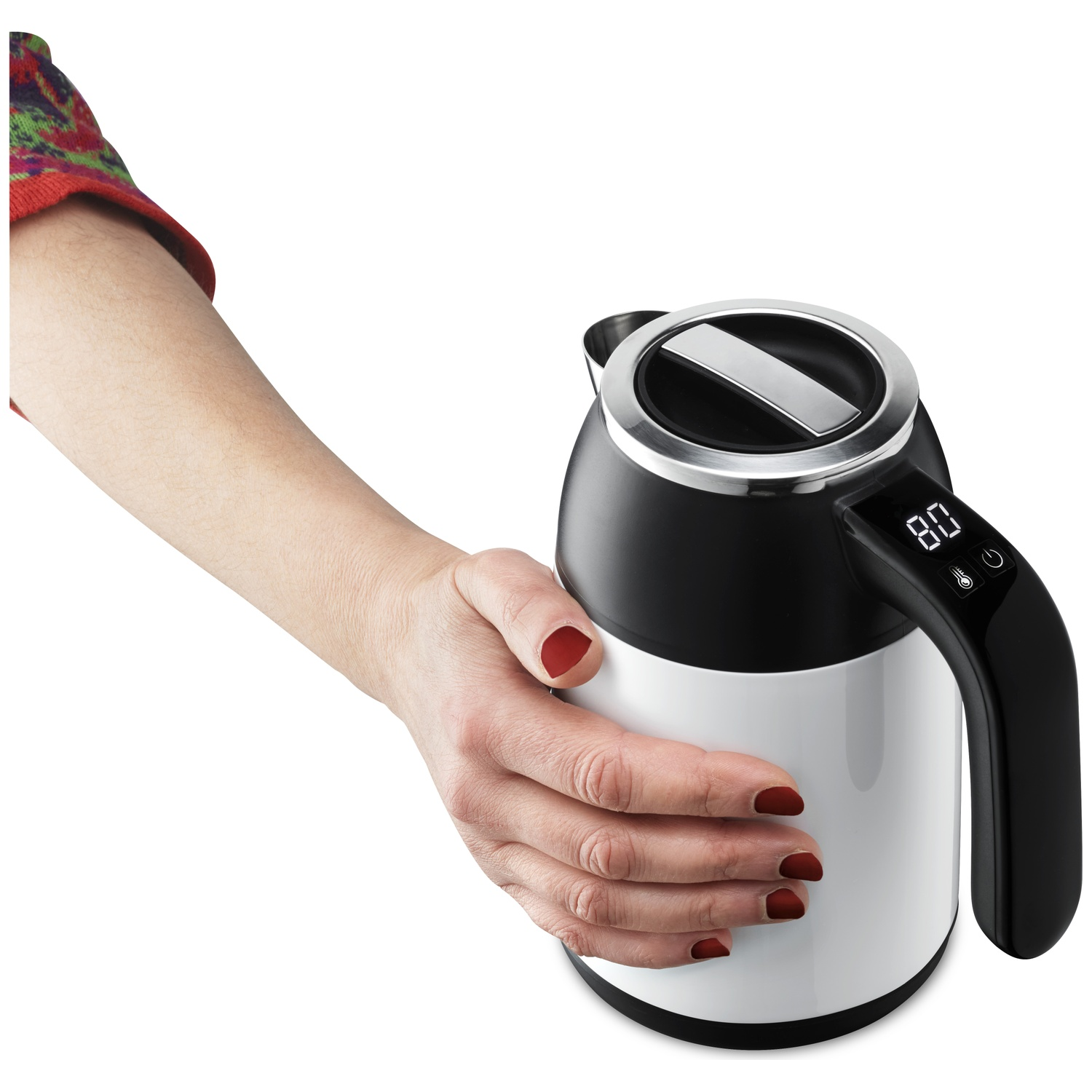 A hand with red fingernails holds a modern black and white electric kettle with a digital display.