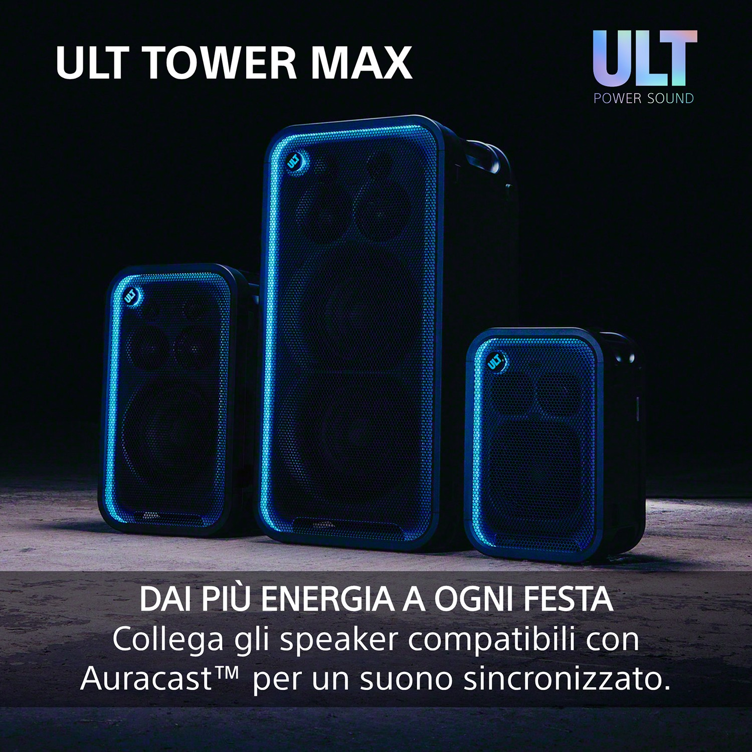 Tre altoparlanti neri ULT TOWER MAX con illuminazione blu sui bordi su un pavimento scuro.