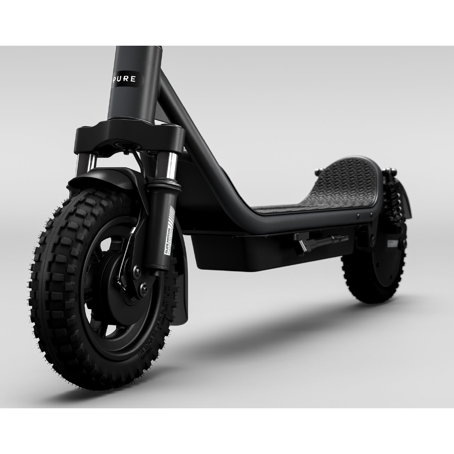 A black electric scooter with knobby tires and front suspension is shown against a grey background.