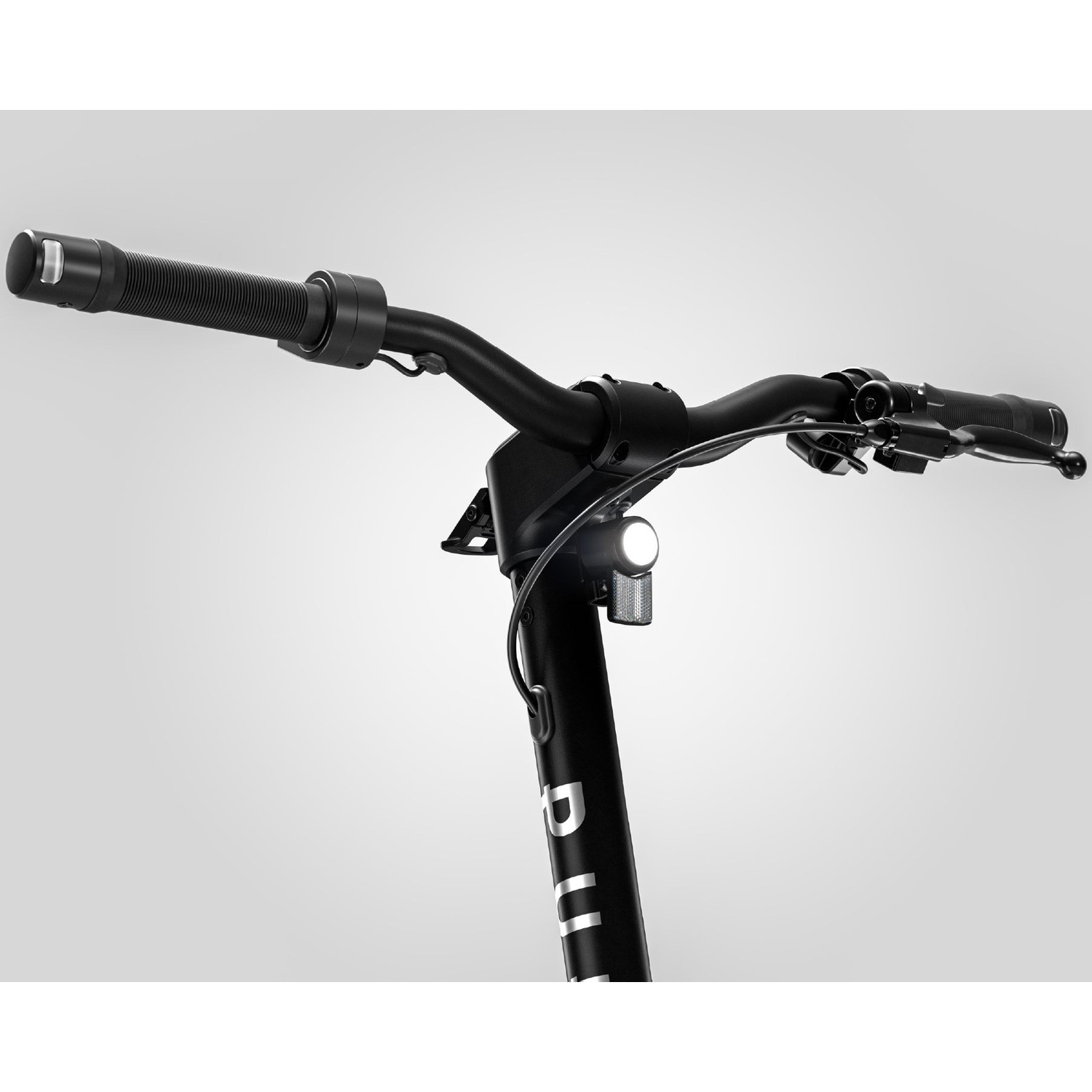 Black e-scooter handlebars with an illuminated headlight and text on the stem against a light background.
