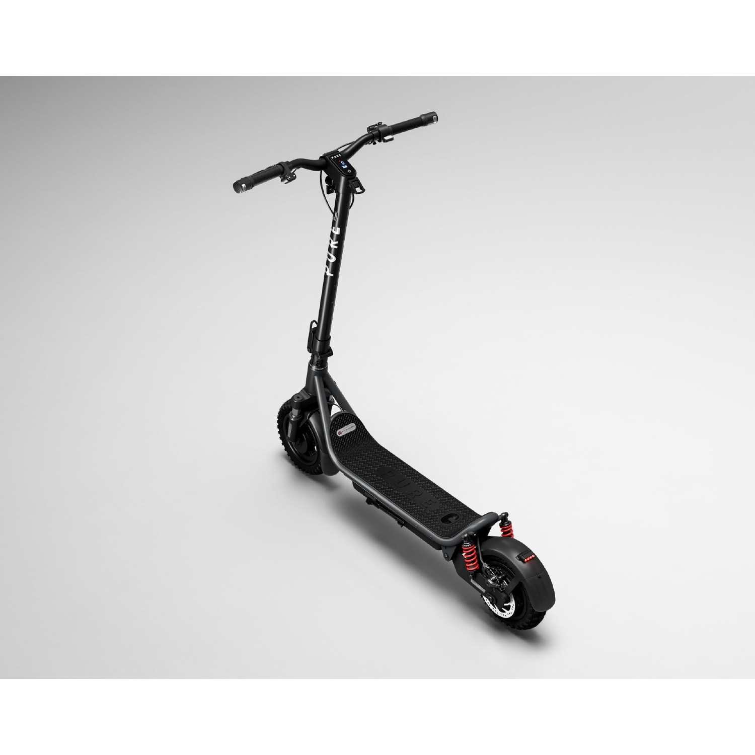 A black electric scooter stands on a light gray background with red rear suspension springs.