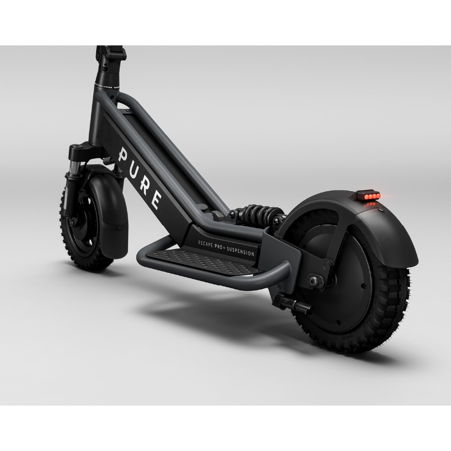 A black Pure Escape Pro+ e-scooter stands on a white background with an illuminated tail light.