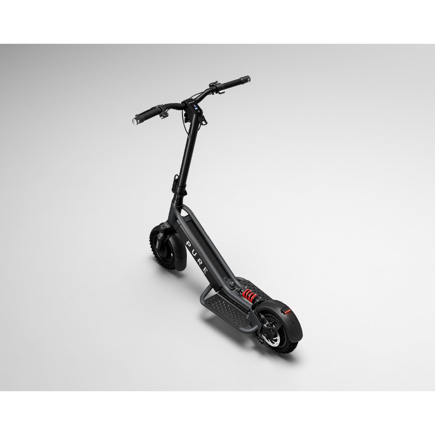 A black electric scooter with a wide deck and red suspension stands on a gray background.