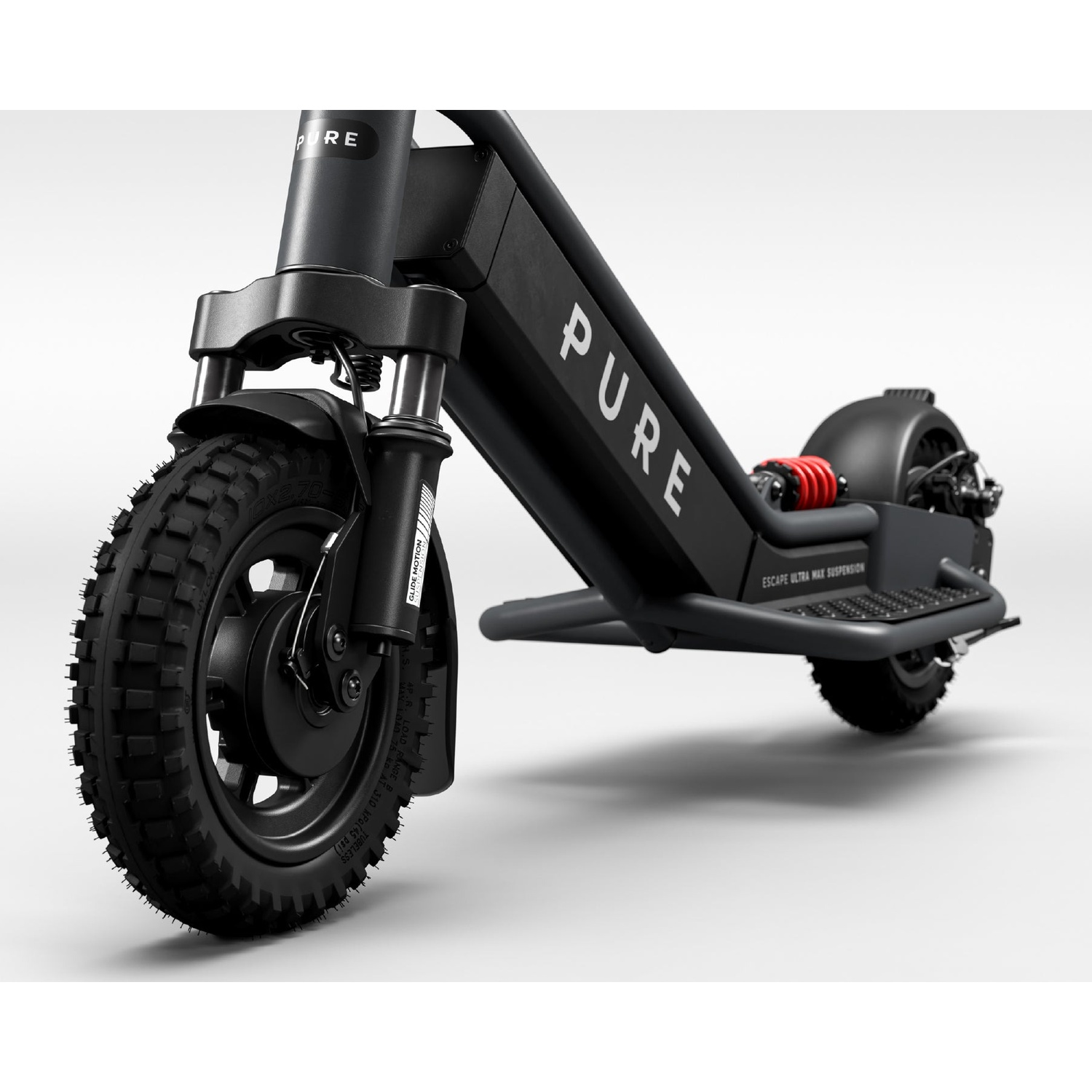 Black electric scooter with knobby tires and red suspension against a light background.