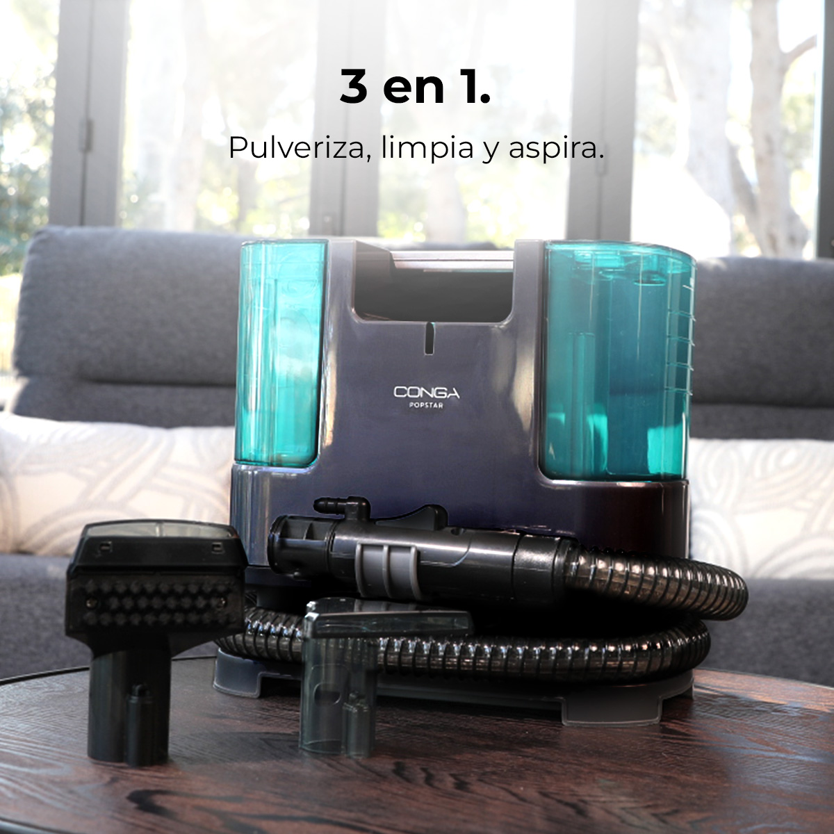 Dispositivo de limpieza Conga Popstar azul con accesorios sobre una mesa de madera.