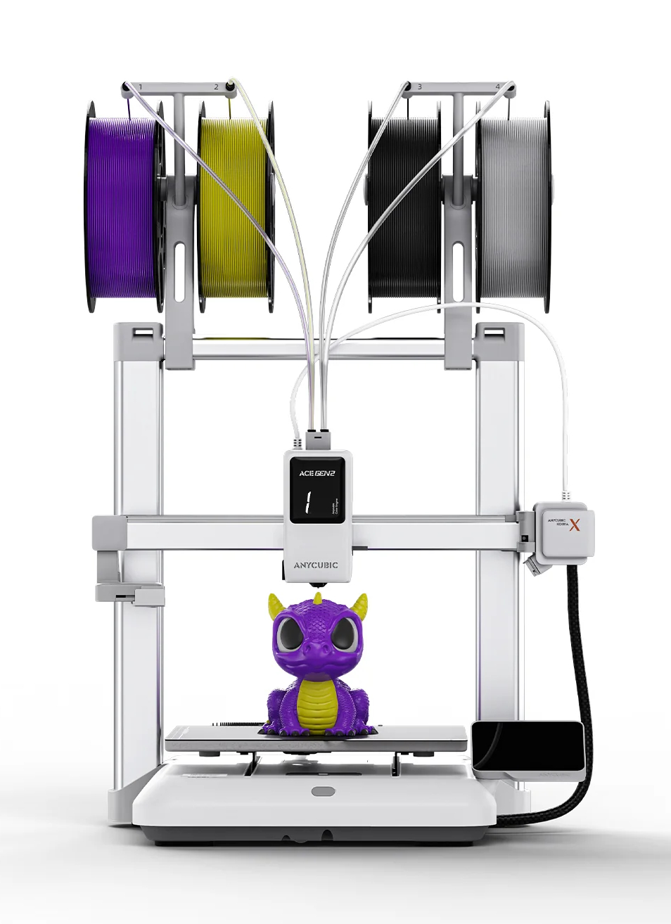 Drukarka 3D drukuje fioletowo-żółtego smoka, z czterema szpulami filamentu u góry.