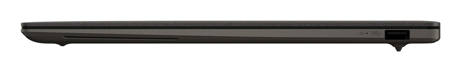 Primer plano del perfil lateral de un portátil gris oscuro, que muestra un puerto USB y luz indicadora.