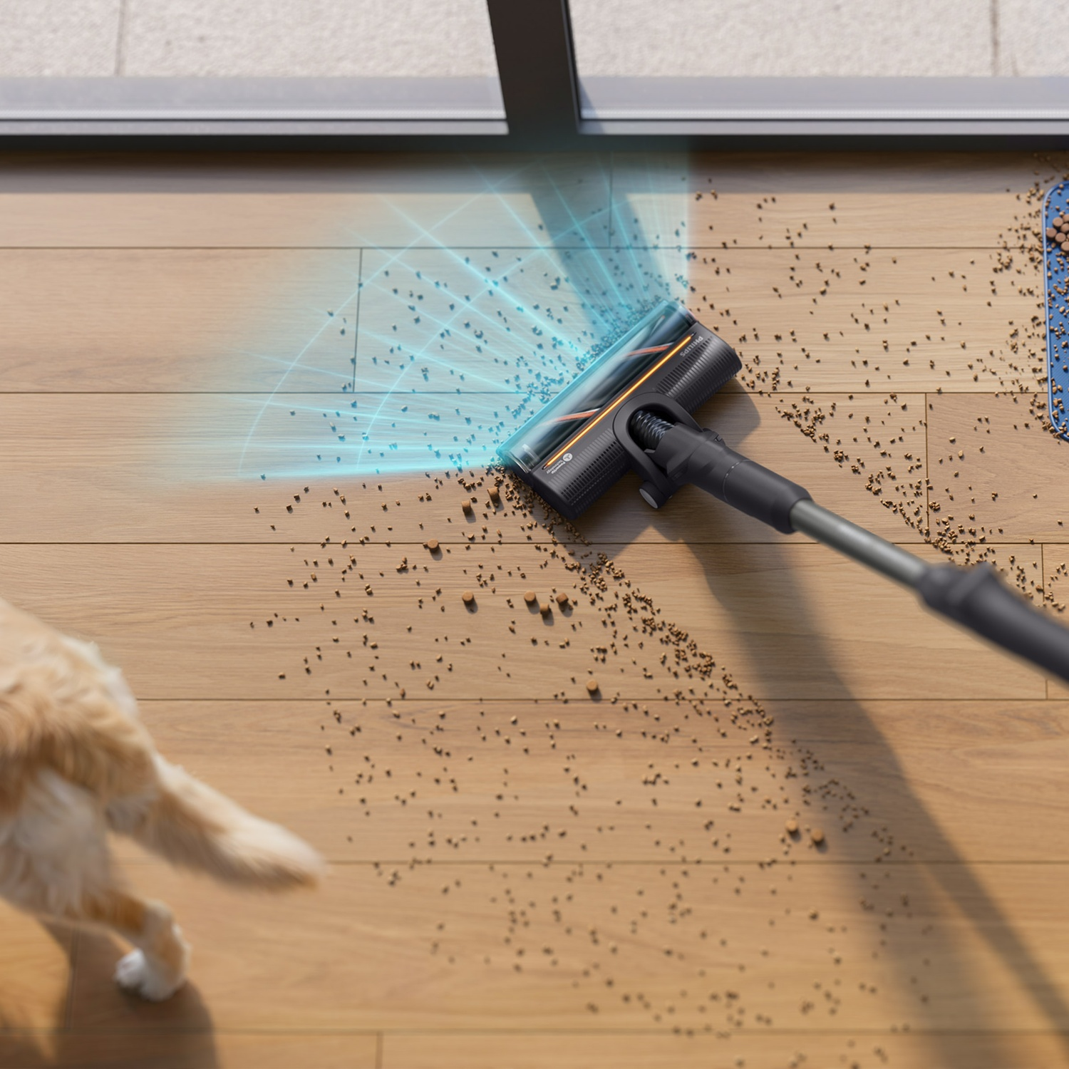 A cordless vacuum cleaner vacuums spilled pet food from a wooden floor near a pet.