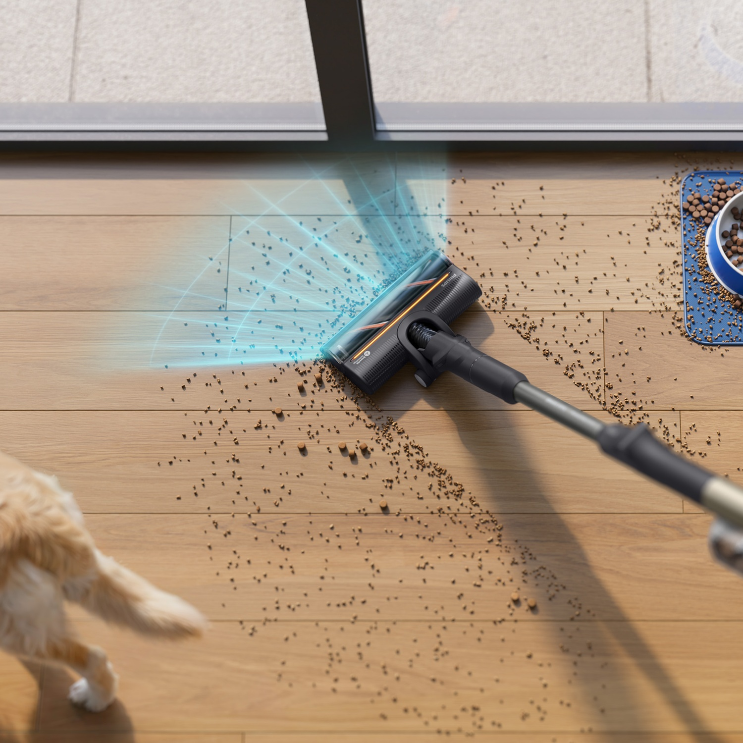 A vacuum cleans pet food from a wooden floor, with a pet bowl and cat visible in the background.