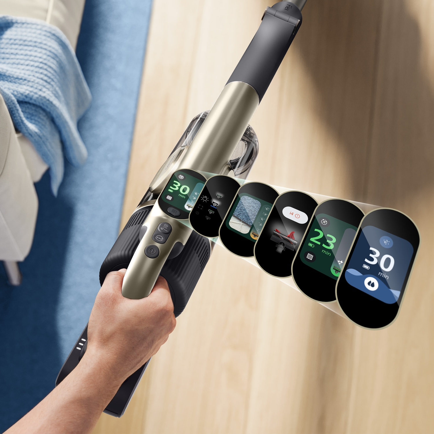 Hand holds a cordless vacuum cleaner, its display showing various operational modes.