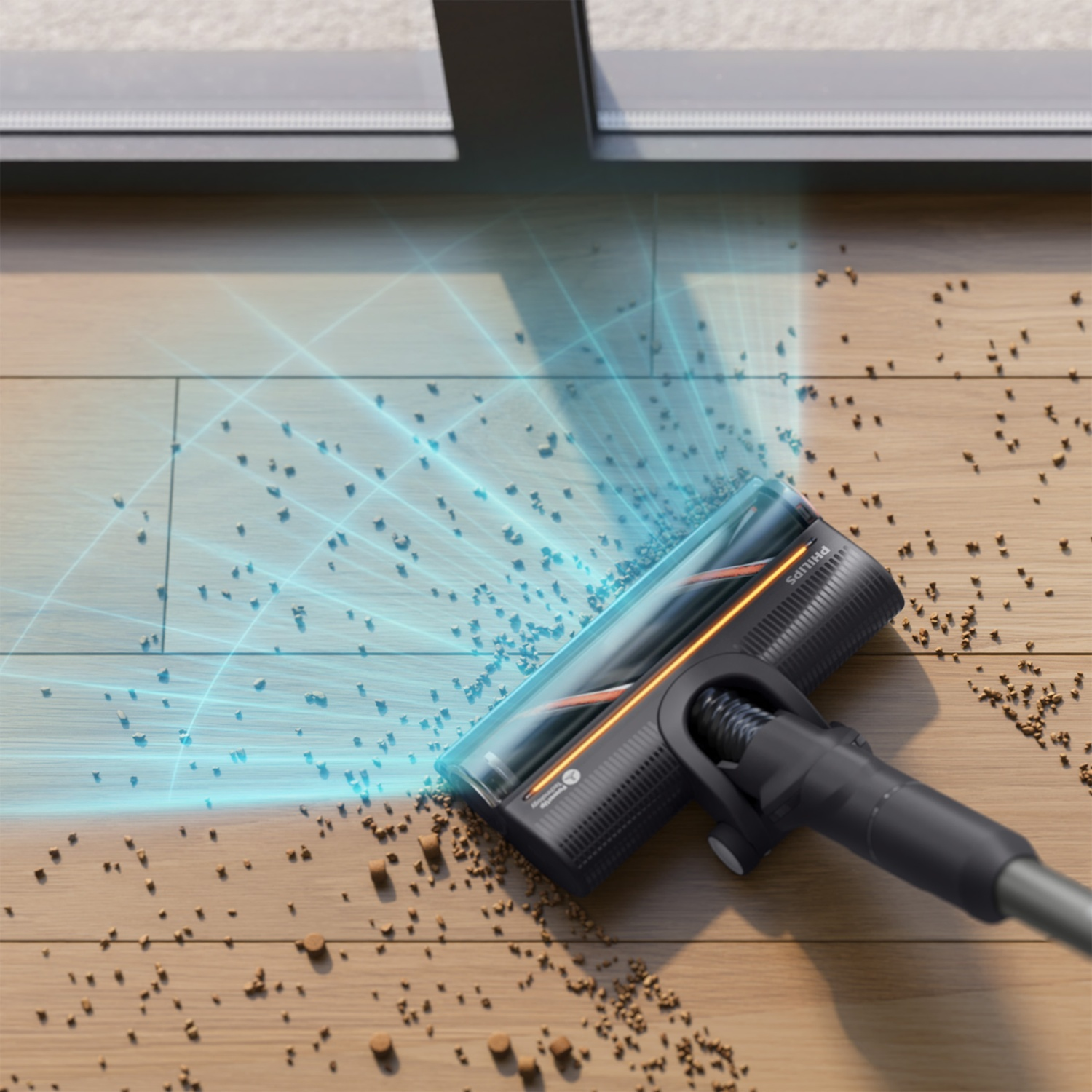 A vacuum cleaner head with blue laser light cleans crumbs from a wooden floor.