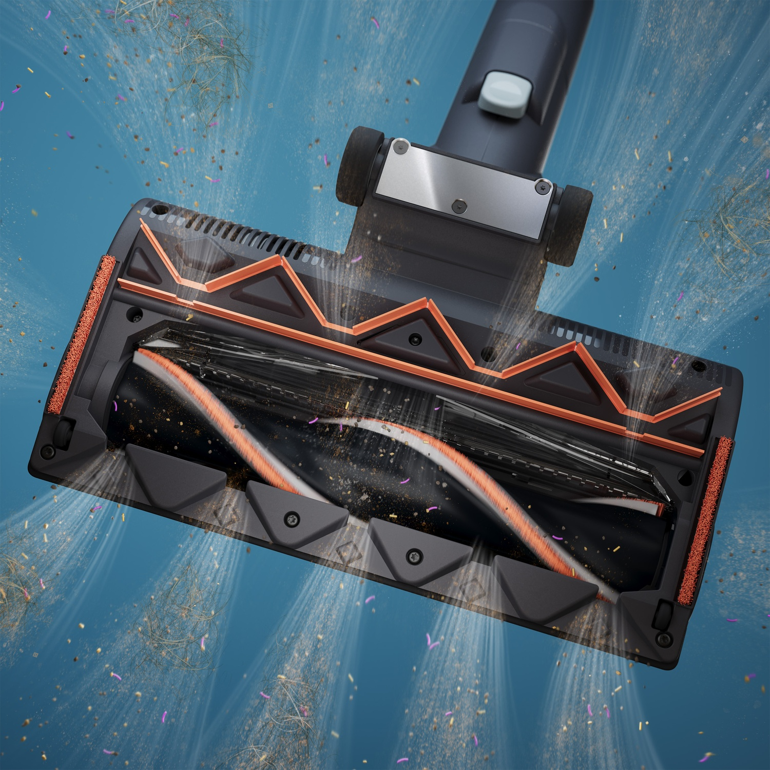 Vacuum cleaner brush suctioning dirt and dust particles against a blue background.