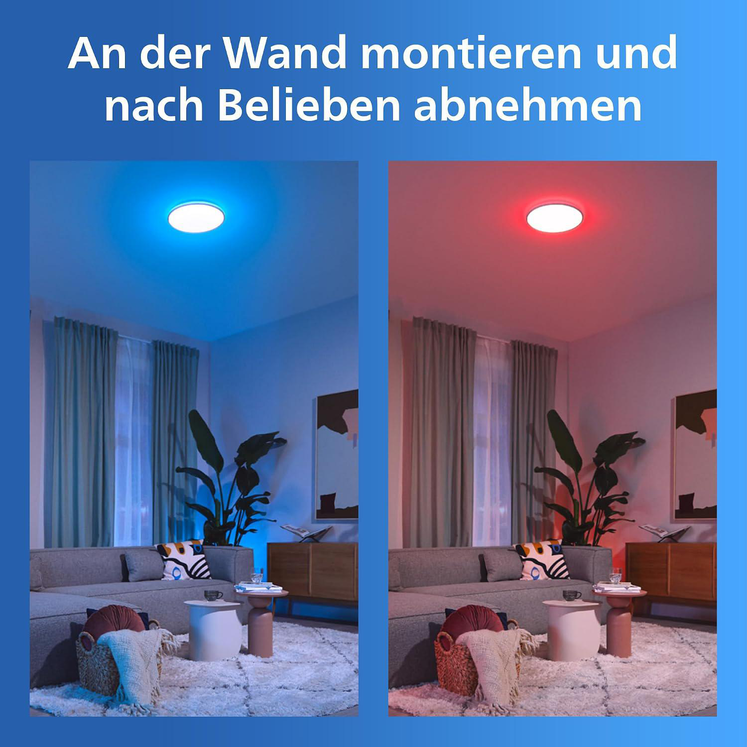Wohnzimmer mit runder Wandlampe, einmal blau und einmal rot leuchtend.