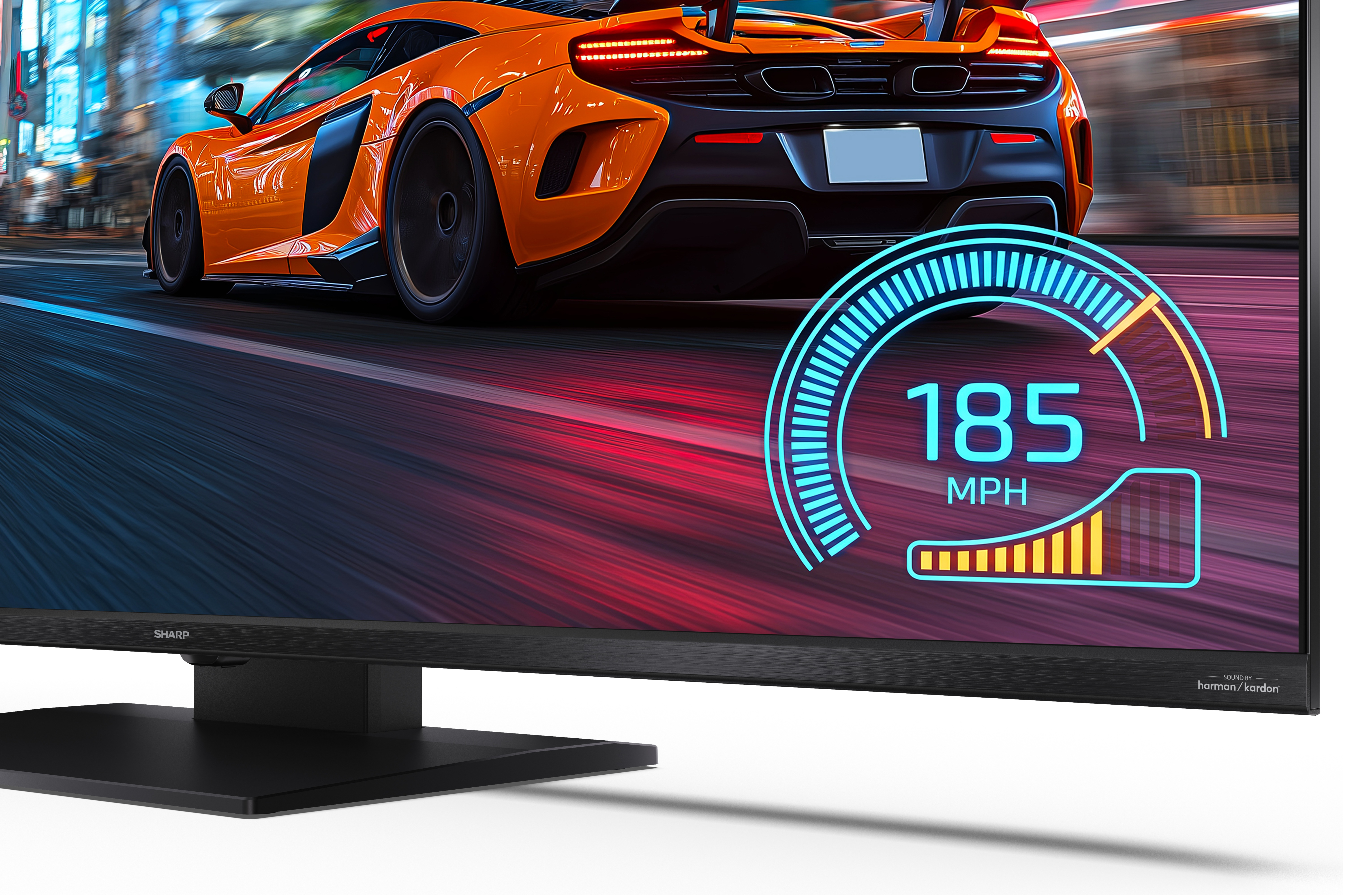 Pomarańczowy samochód sportowy pędzi na ekranie z prędkościomierzem 185 MPH.