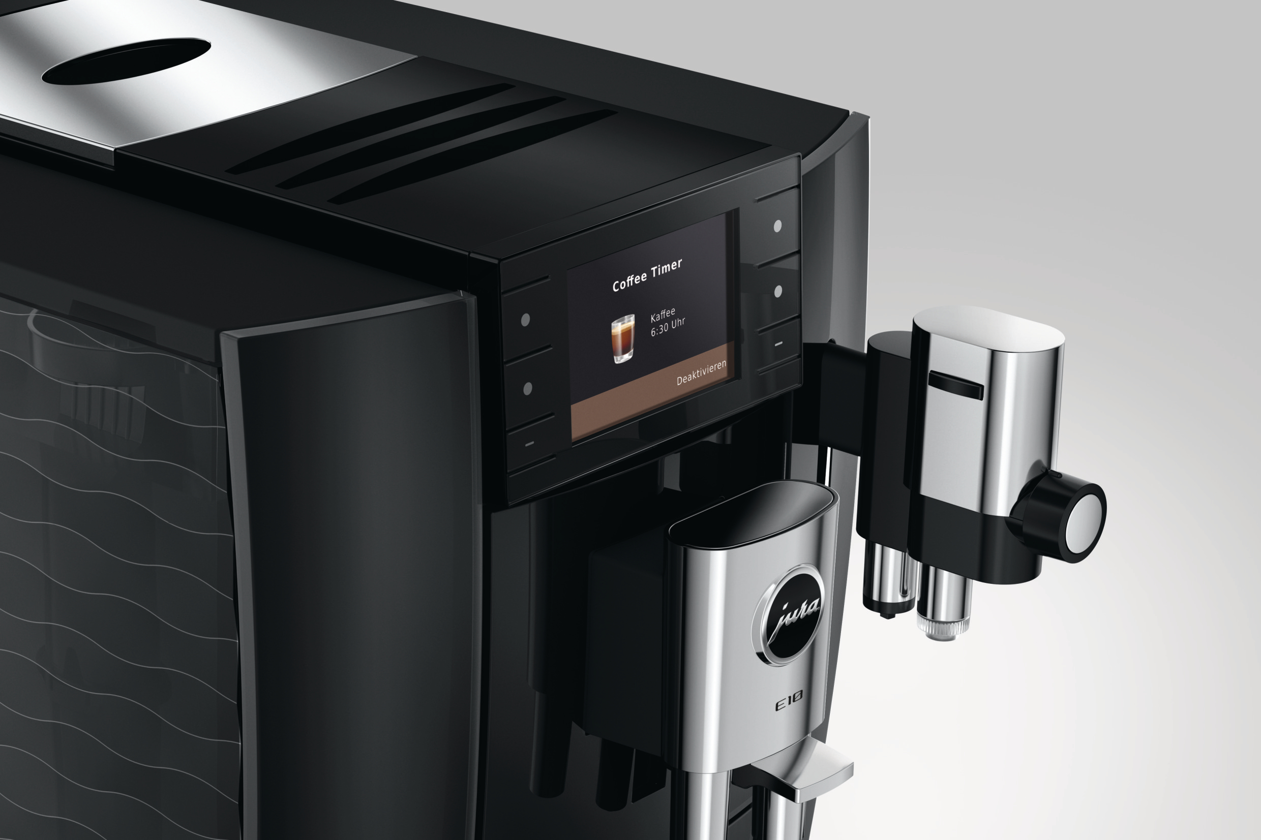 Schwarzer Jura E8 Kaffeevollautomat mit Touchscreen und silbernen Ausläufern auf hellem Hintergrund.