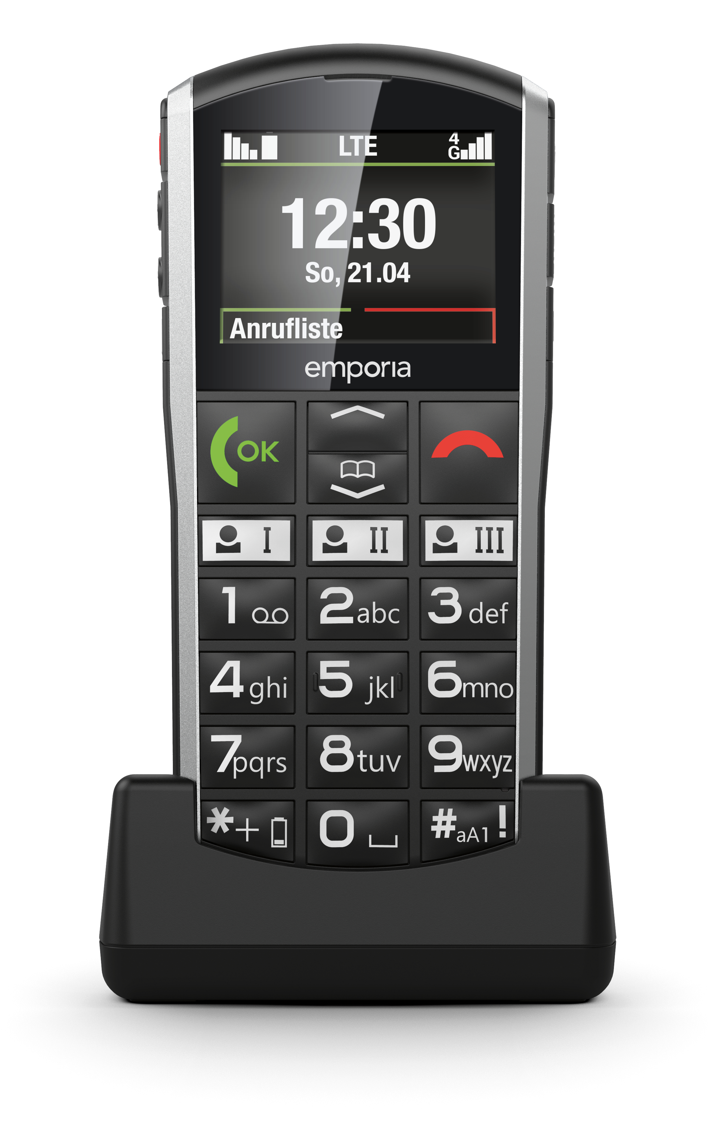 Ein Emporia-Seniorenhandy in Schwarz-Silber mit großen Tasten und Ladestation.
