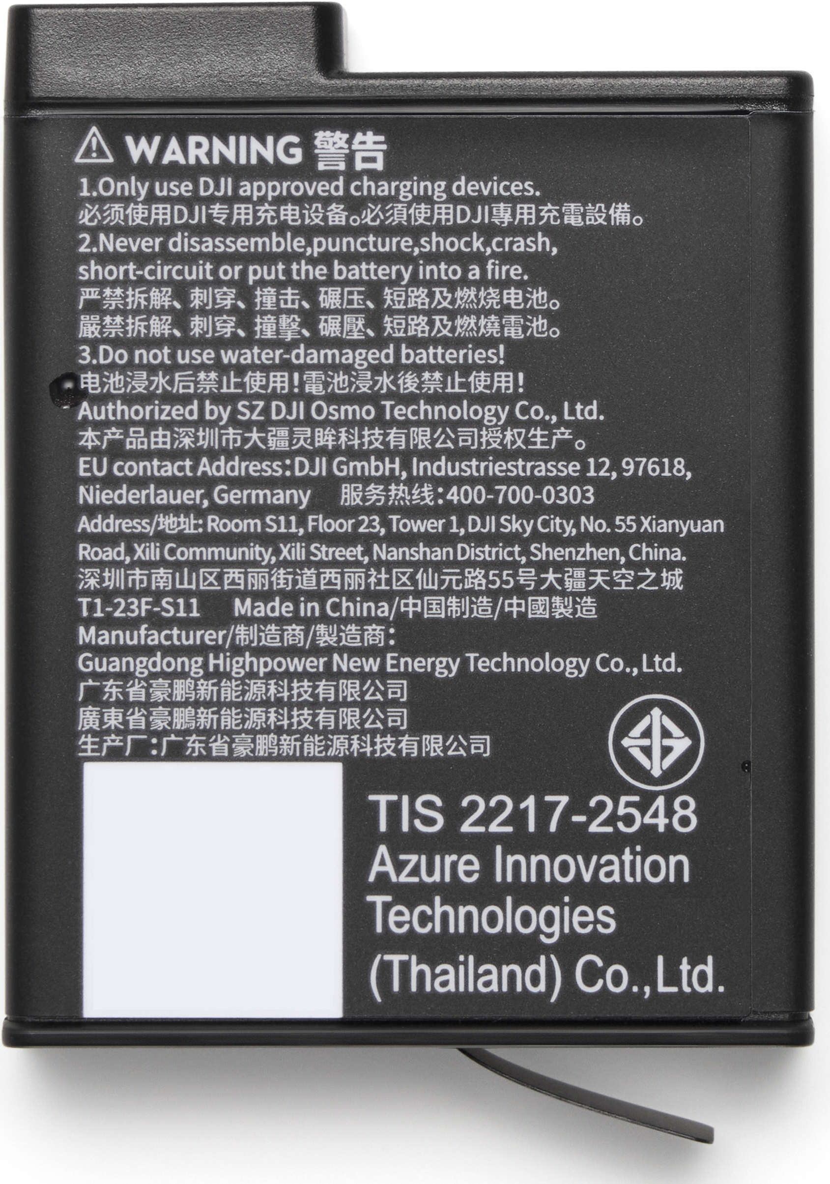 Batterie noire avec texte d'avertissement blanc en anglais et chinois, et détails.