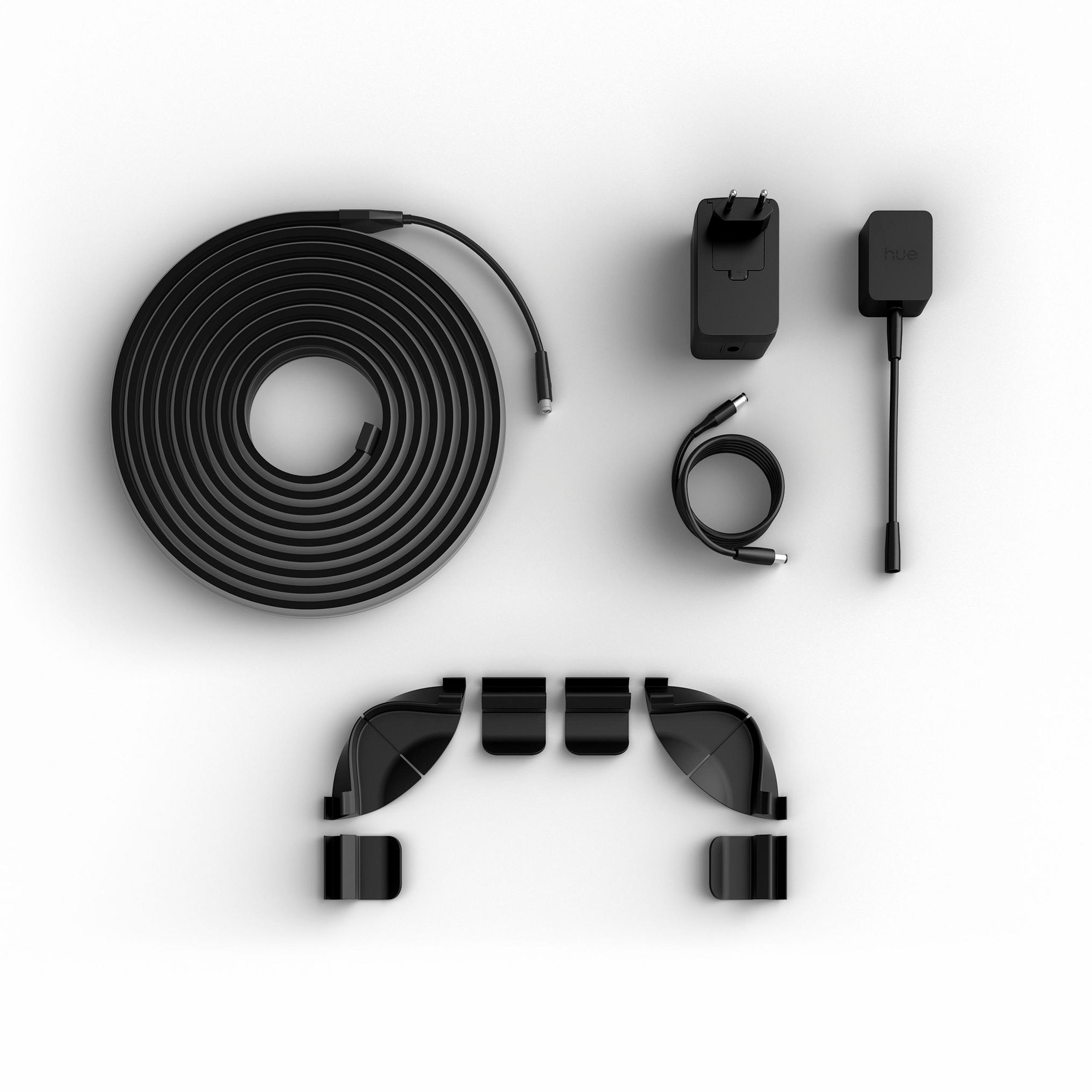 Schwarzes Philips Hue Lichtband mit Netzteil, Kabel und Montagesclips auf weißem Hintergrund.