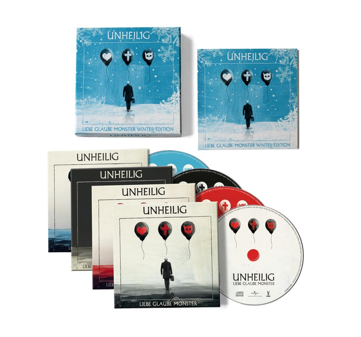 Unheilig 'Liebe Glaube Monster' Album-Box mit CDs und Booklets in blauen und weißen Farben auf weißem Hintergrund.