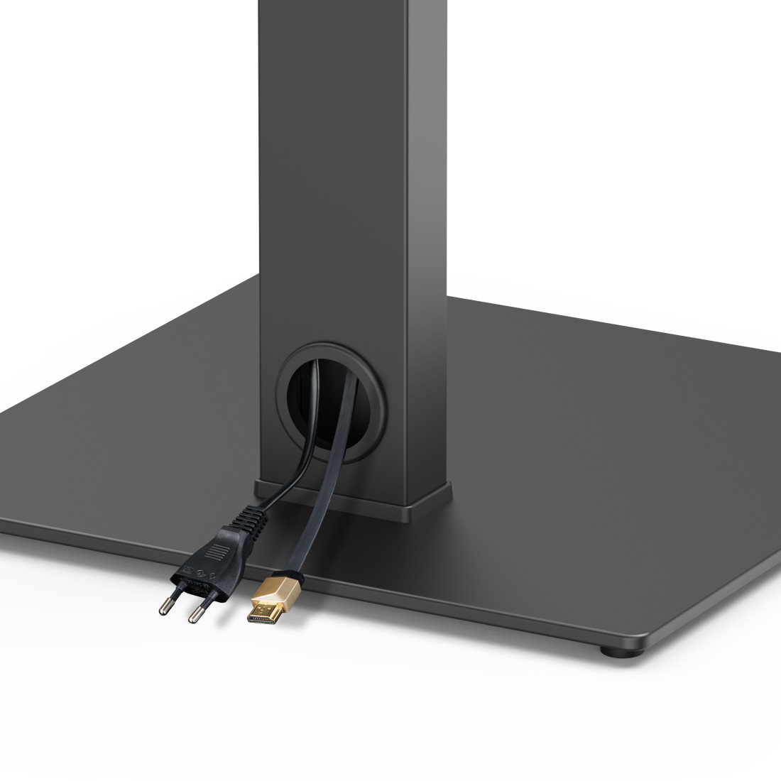 Egy fekete állvány két kábellel, egy dugóval és egy arany HDMI-kábellel, amelyek egy nyílásból jönnek ki.