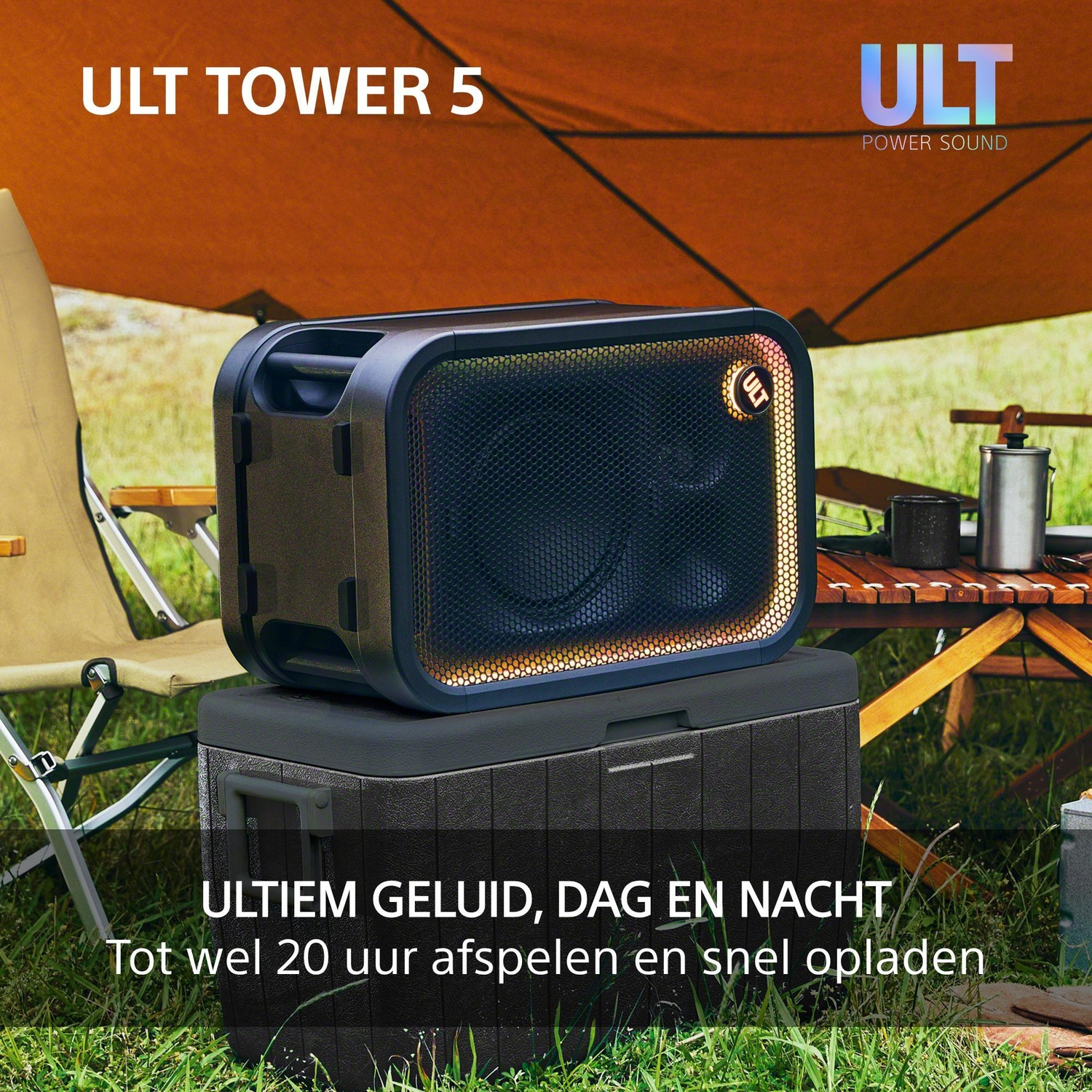 A portable ULT TOWER 5 speaker sits on a cooler during a camping trip under a tent.