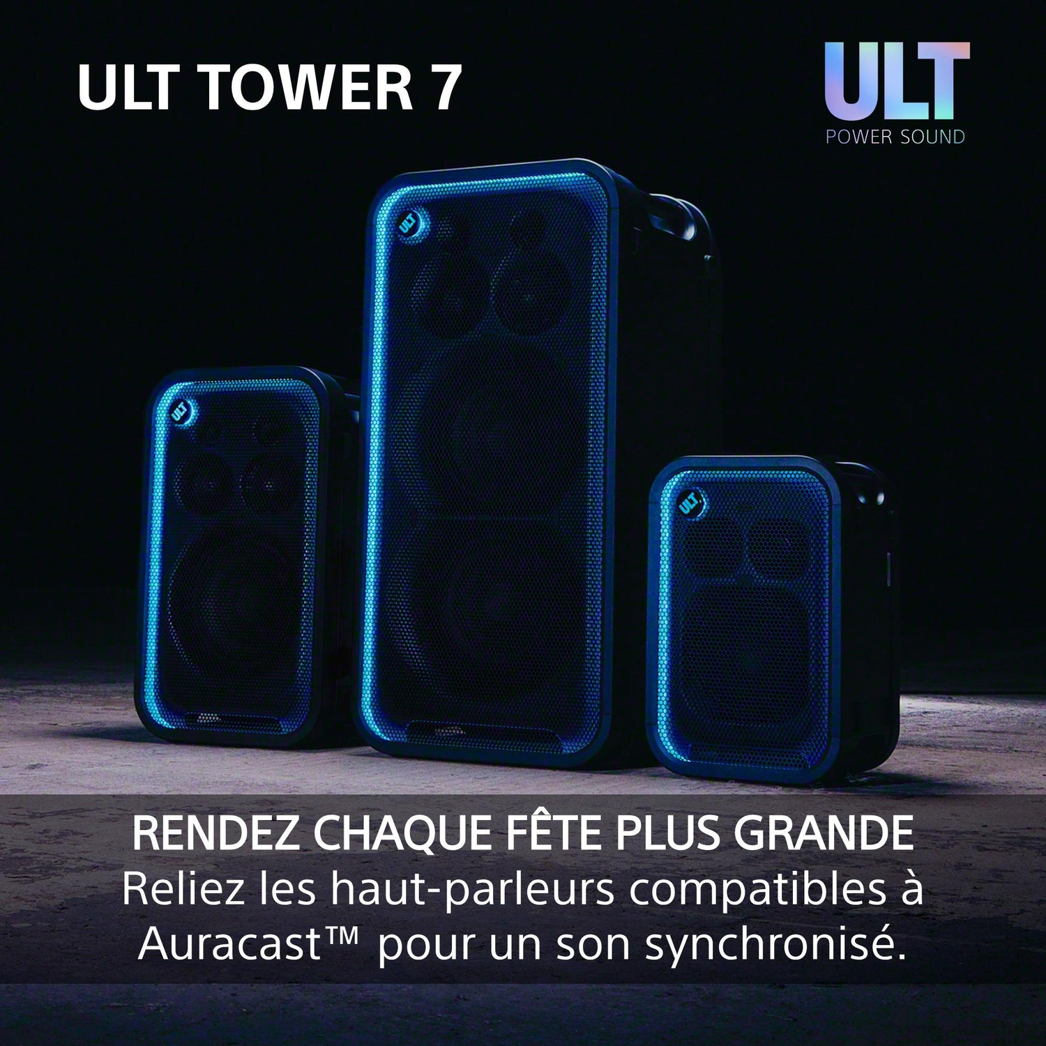 Trois enceintes noires ULT Tower 7 avec éclairage bleu sur sol sombre.