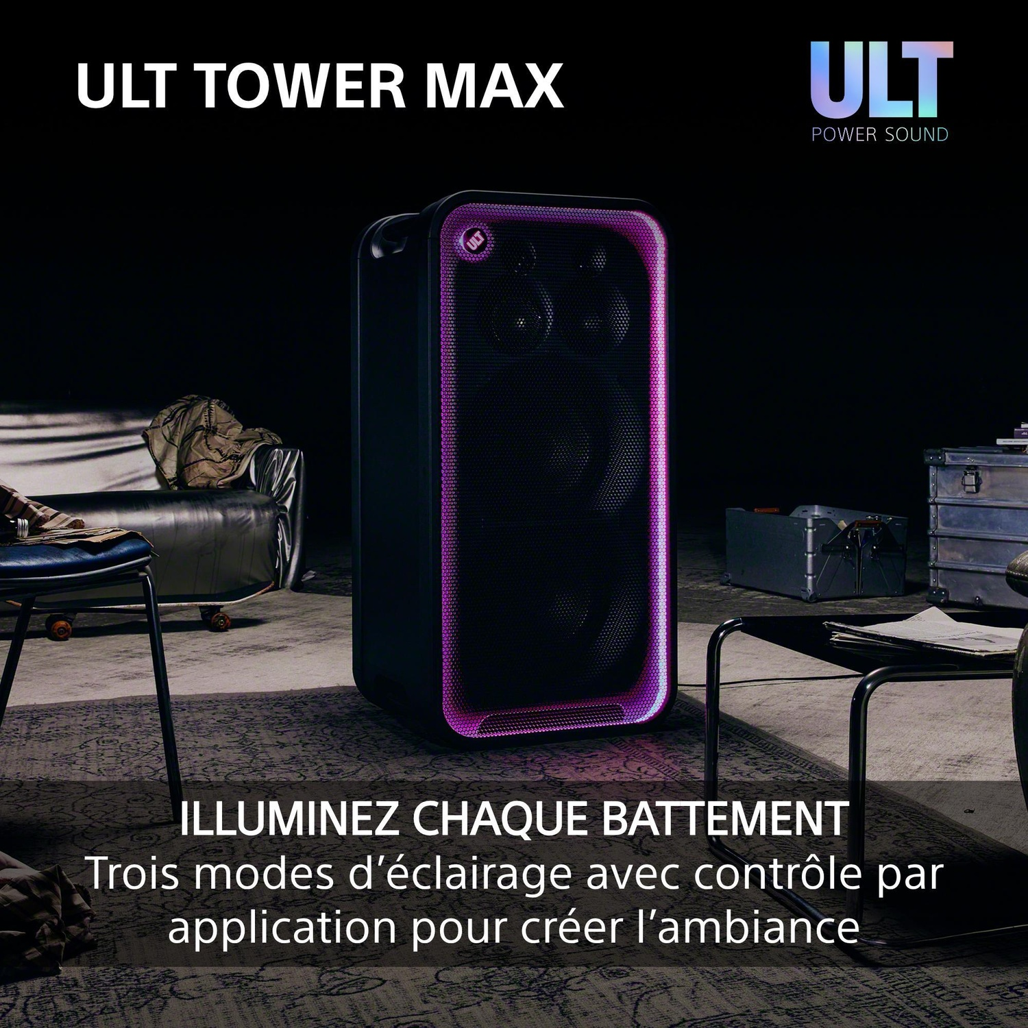 Enceinte noire ULT Tower Max avec éclairage rose sur les bords dans une pièce sombre.