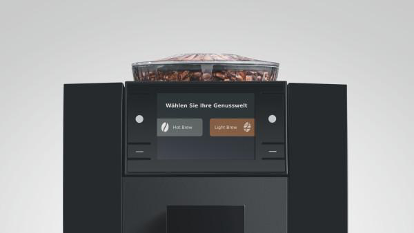 Schwarze Kaffeemaschine mit einem digitalen Display und Bohnenbehälter oben.
