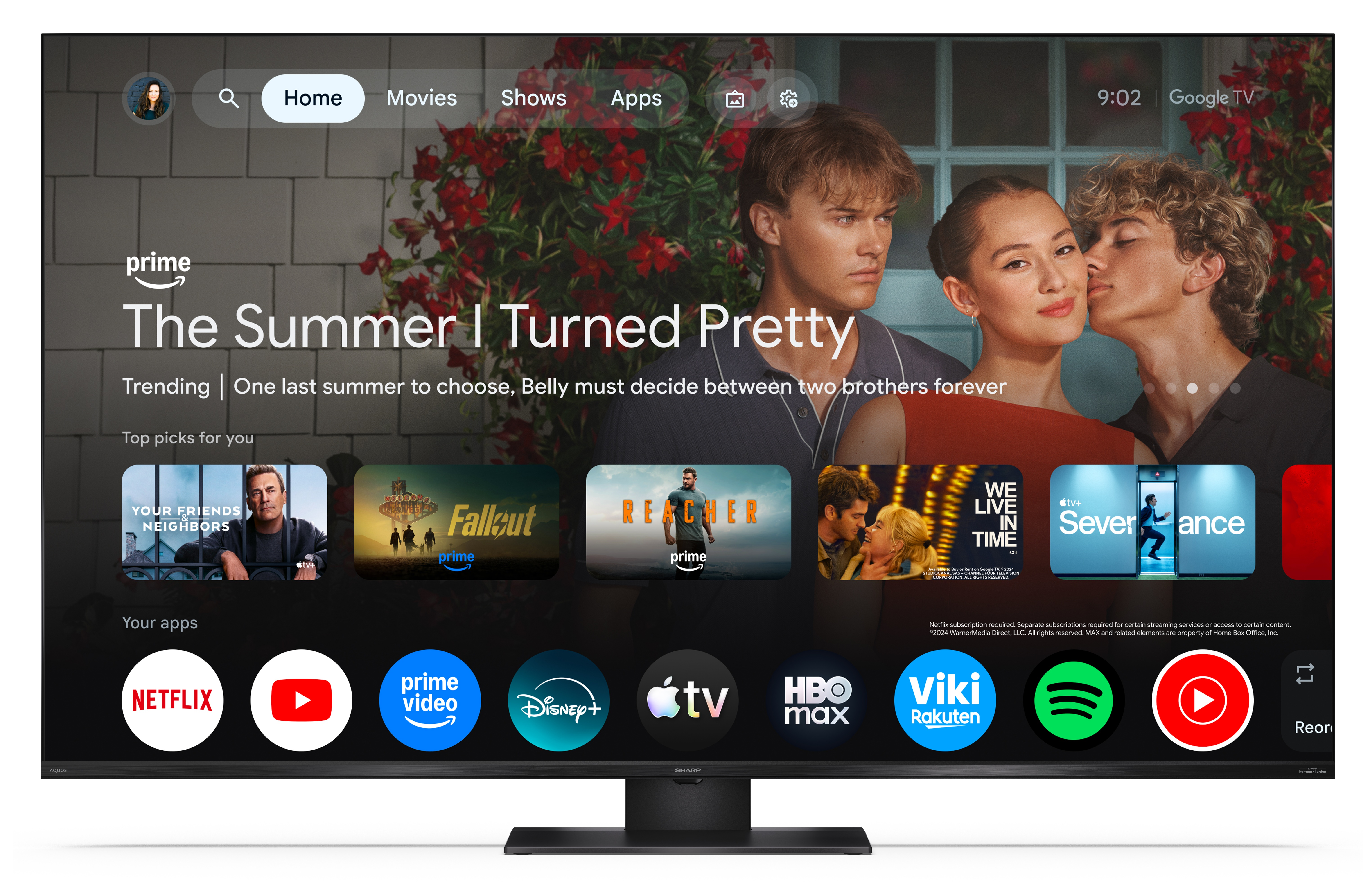 Ekran telewizora Smart TV z stroną główną Google TV, menu, reklamą Prime Video i ikonami aplikacji na dole.