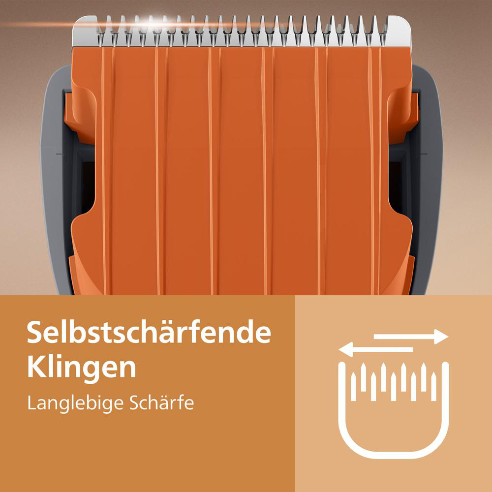 Nahaufnahme einer orangefarbenen Haarschneidemaschine mit silbernen Klingen und Text zu selbtschärfenden Klingen.