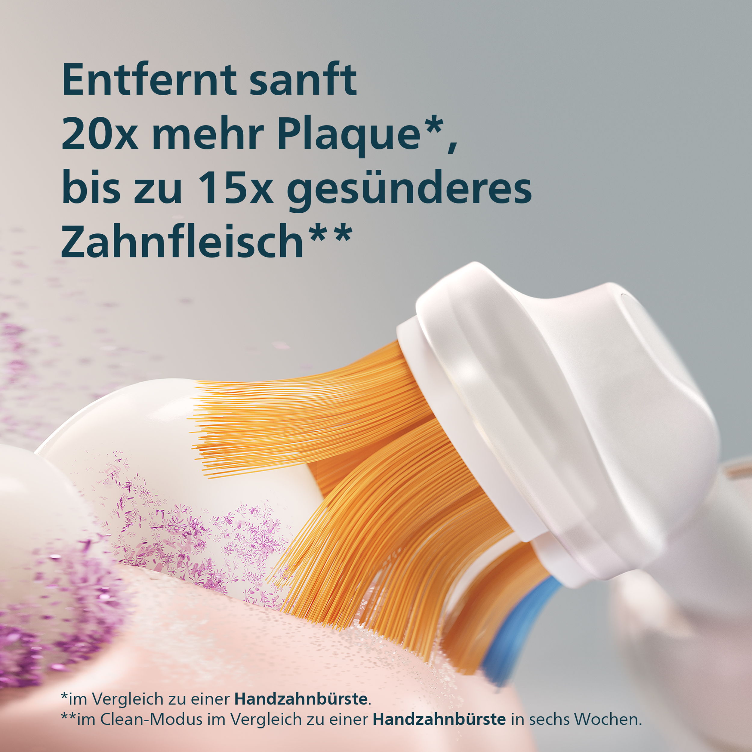 Une brosse à dents électrique nettoie les dents et élimine en douceur la plaque avec des poils orange.