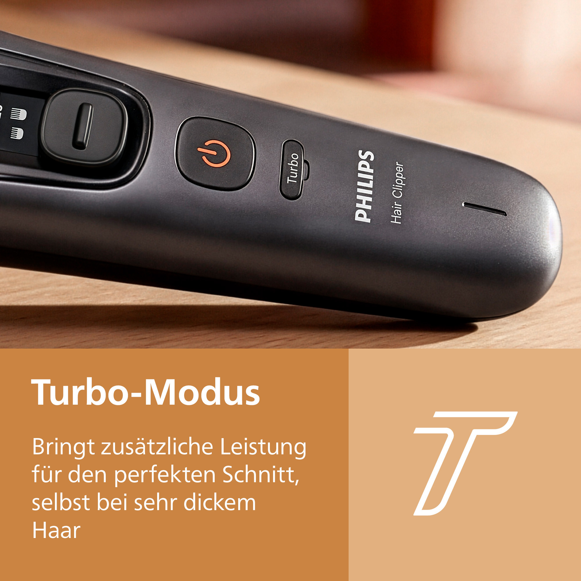 Gros plan d'une tondeuse à cheveux Philips avec bouton mode Turbo sur surface en bois.