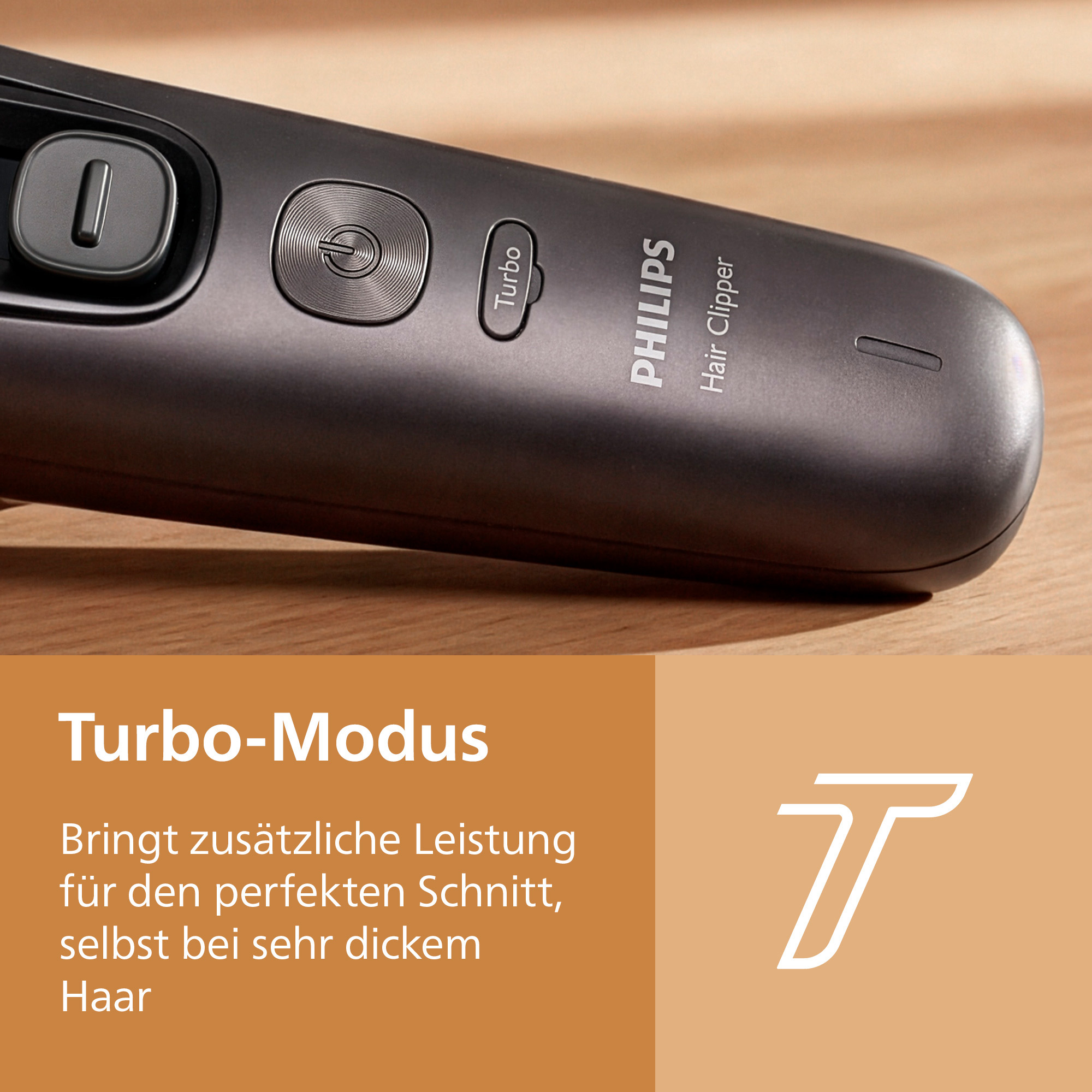 Tondeuse à cheveux Philips grise avec boutons d'alimentation et turbo sur bois, avec encadré marron en bas.