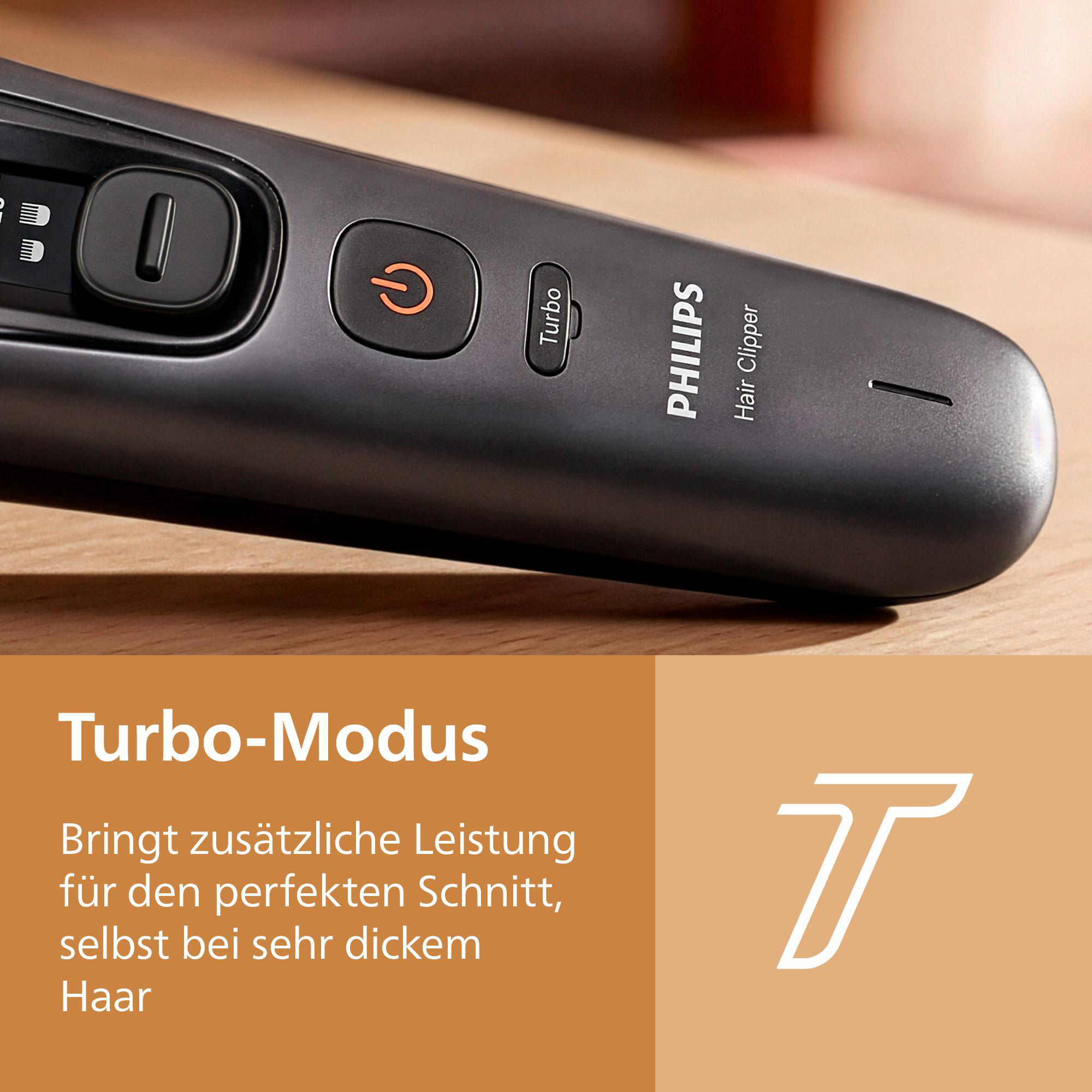 Nahaufnahme eines grauen Philips-Haarschneiders mit Turbo-Modus-Taste und Text über Zusatzleistung.
