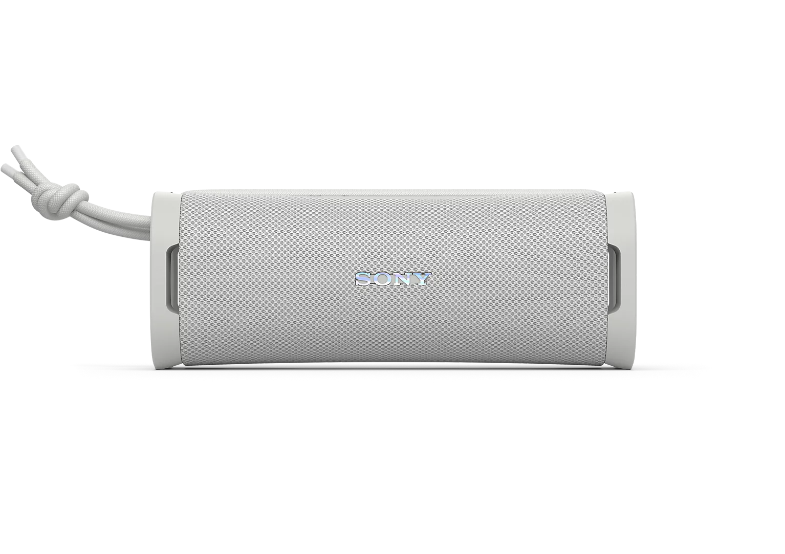 Siyah arka planda taşıma kayışına sahip beyaz silindirik bir Sony Bluetooth hoparlör.