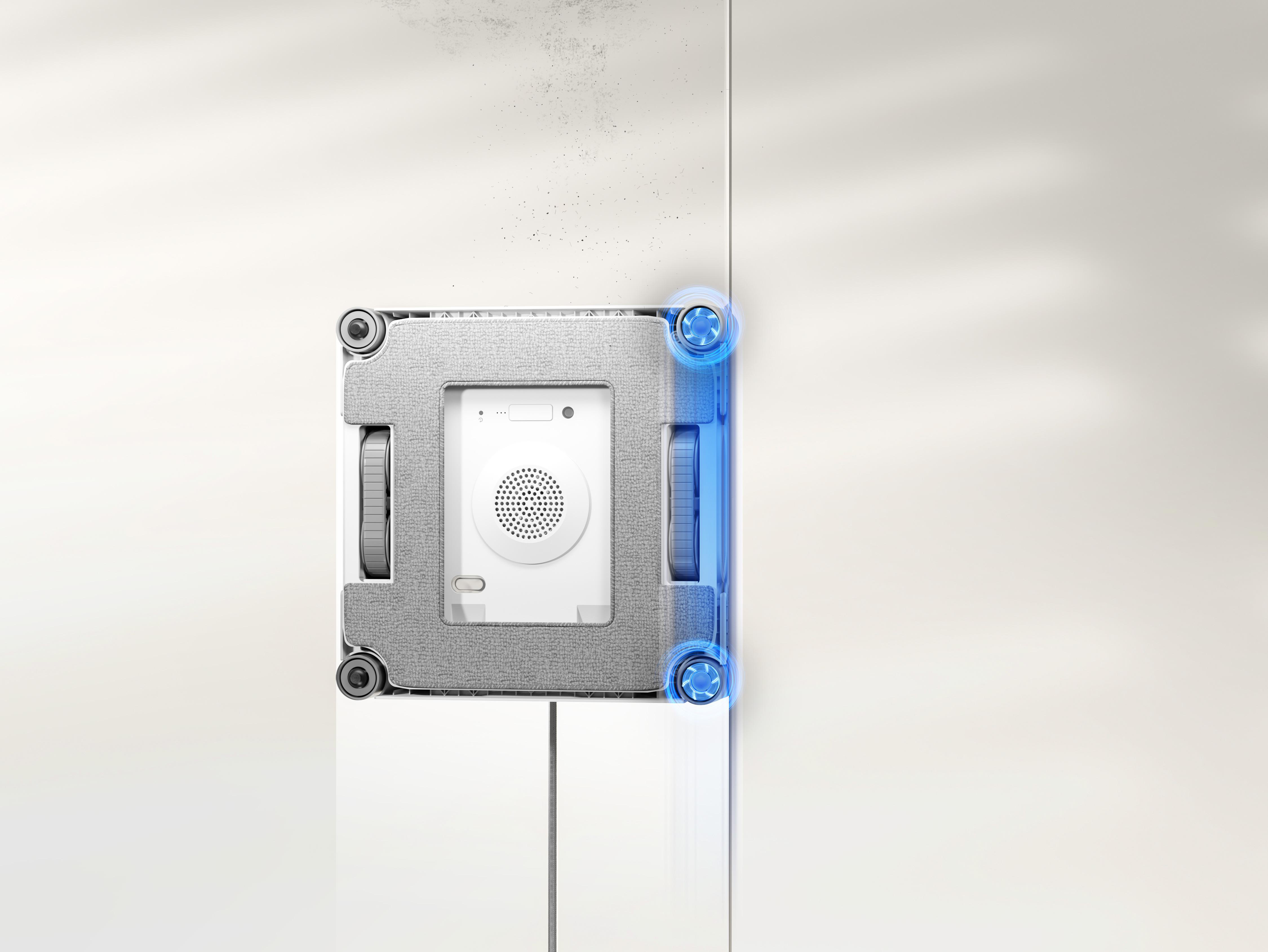 Ein weißer Fensterreinigungsroboter reinigt eine Glasfläche, mit blauen Kontrollleuchten an der Seite.
