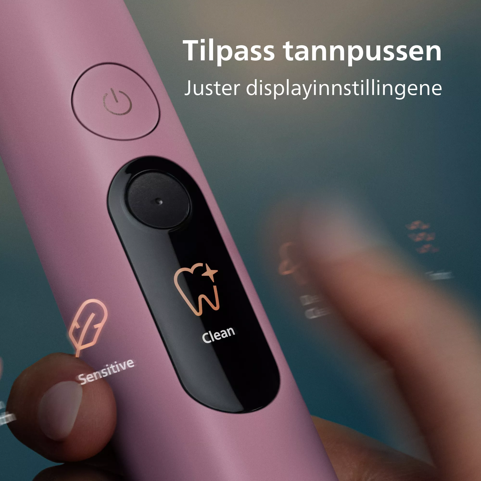 Rózsaszín elektromos fogkefe digitális kijelzővel, amely a 'Clean' módot mutatja.