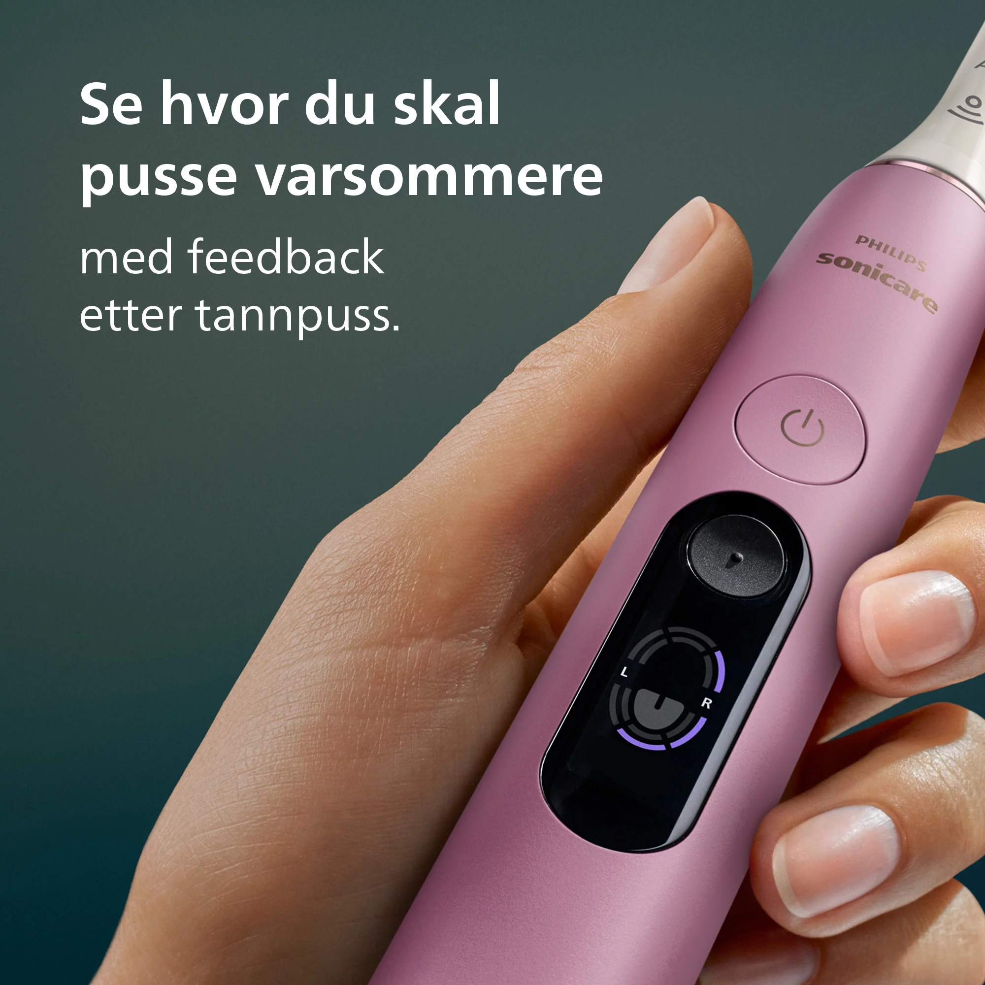 Egy kéz egy rózsaszín Philips Sonicare elektromos fogkefét tart digitális kijelzővel.