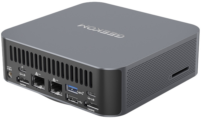 Szürke mini PC hátulján különféle portok, tetején márkajelzés.