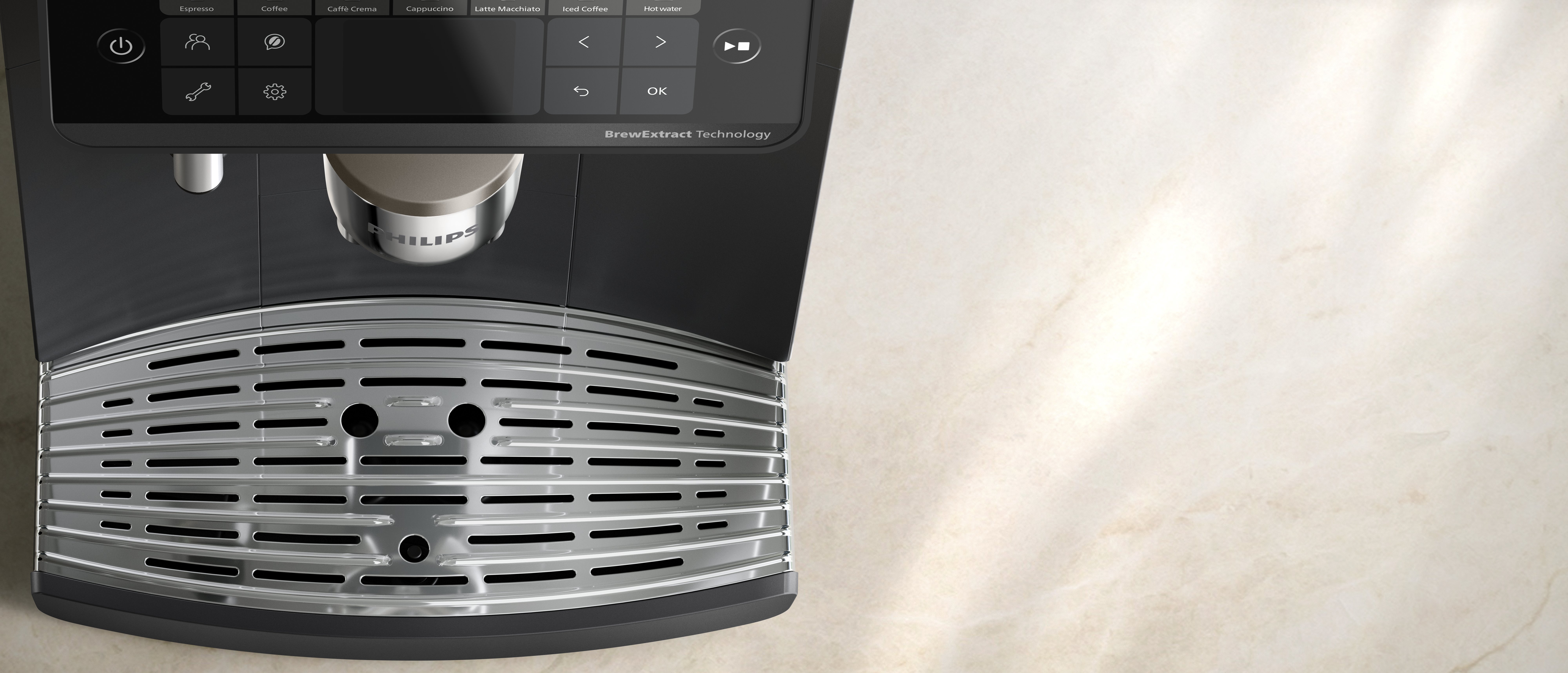 Nahaufnahme einer modernen Philips Espressomaschine mit digitalem Bedienfeld und metallischer Abtropfschale.