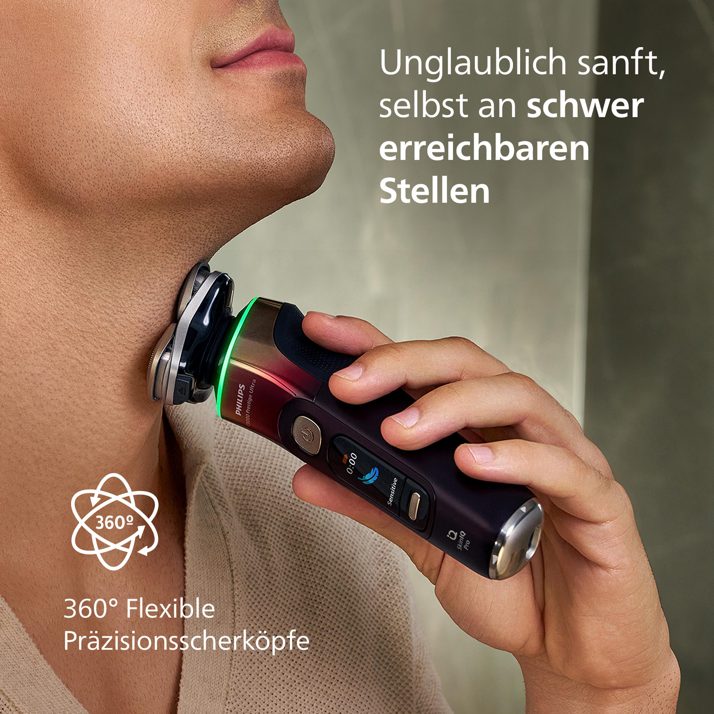Ein Mann rasiert seinen Hals mit einem modernen Philips Elektrorasierer.