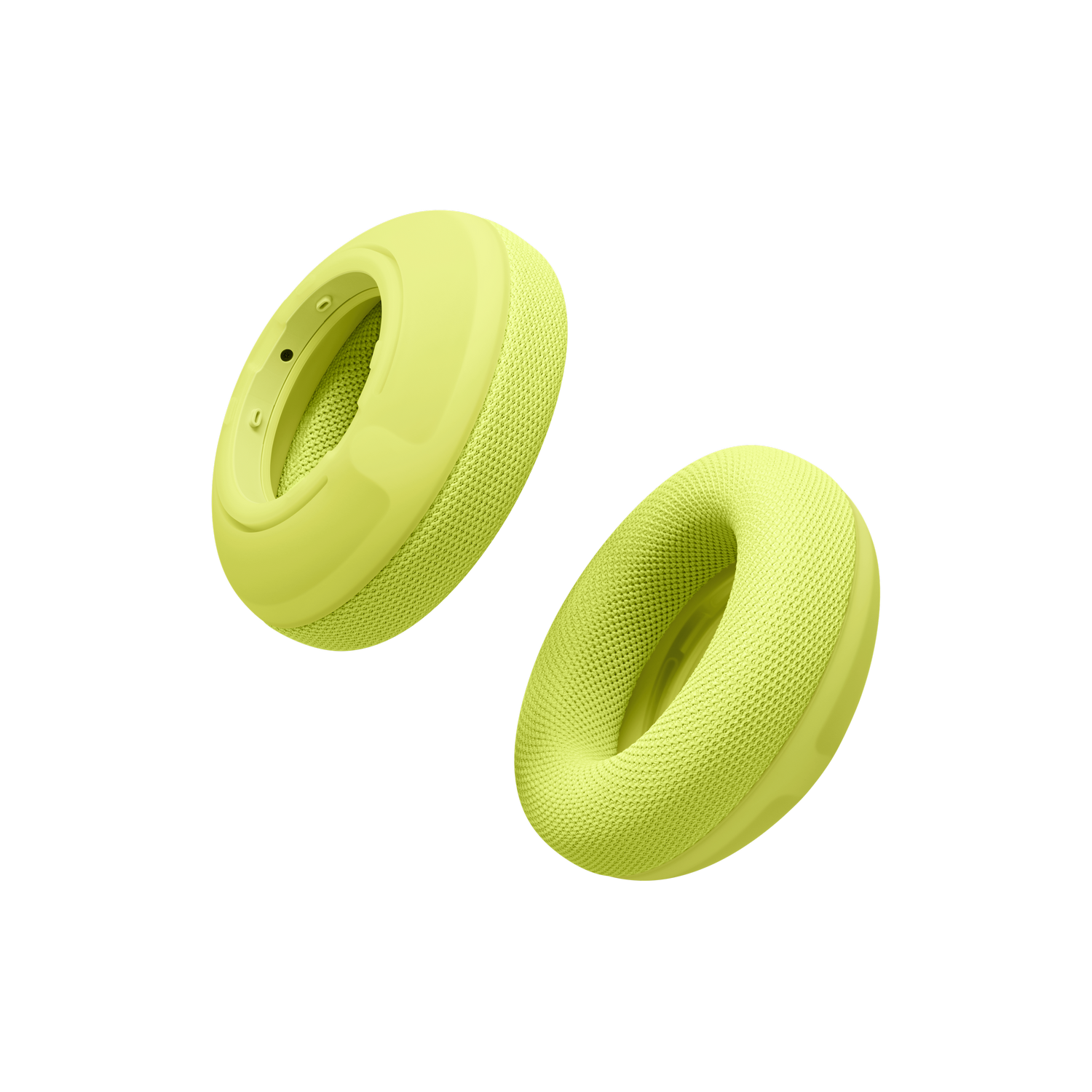 Dos almohadillas de auriculares verde claro flotan sobre un fondo negro.