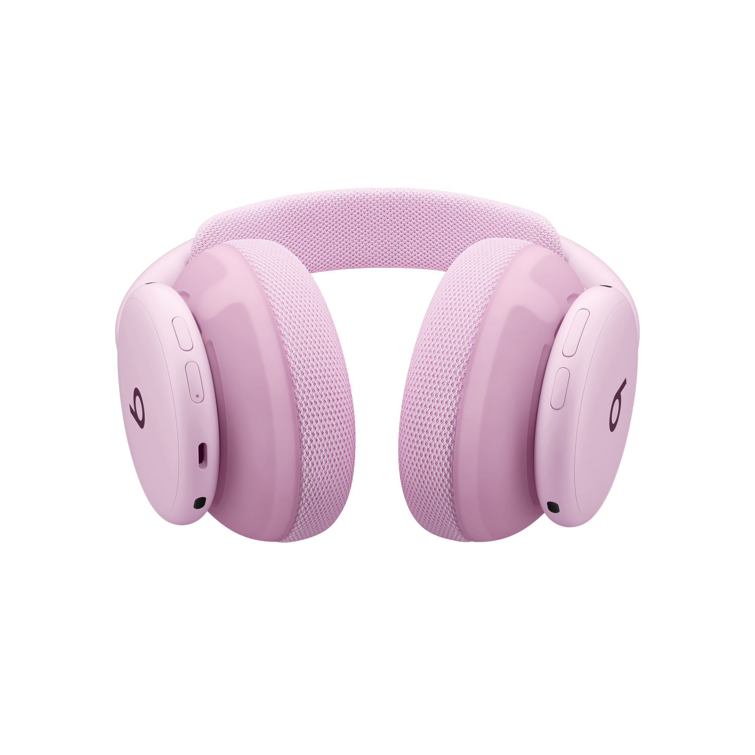 Auriculares inalámbricos de diadema en color rosa sobre fondo negro.