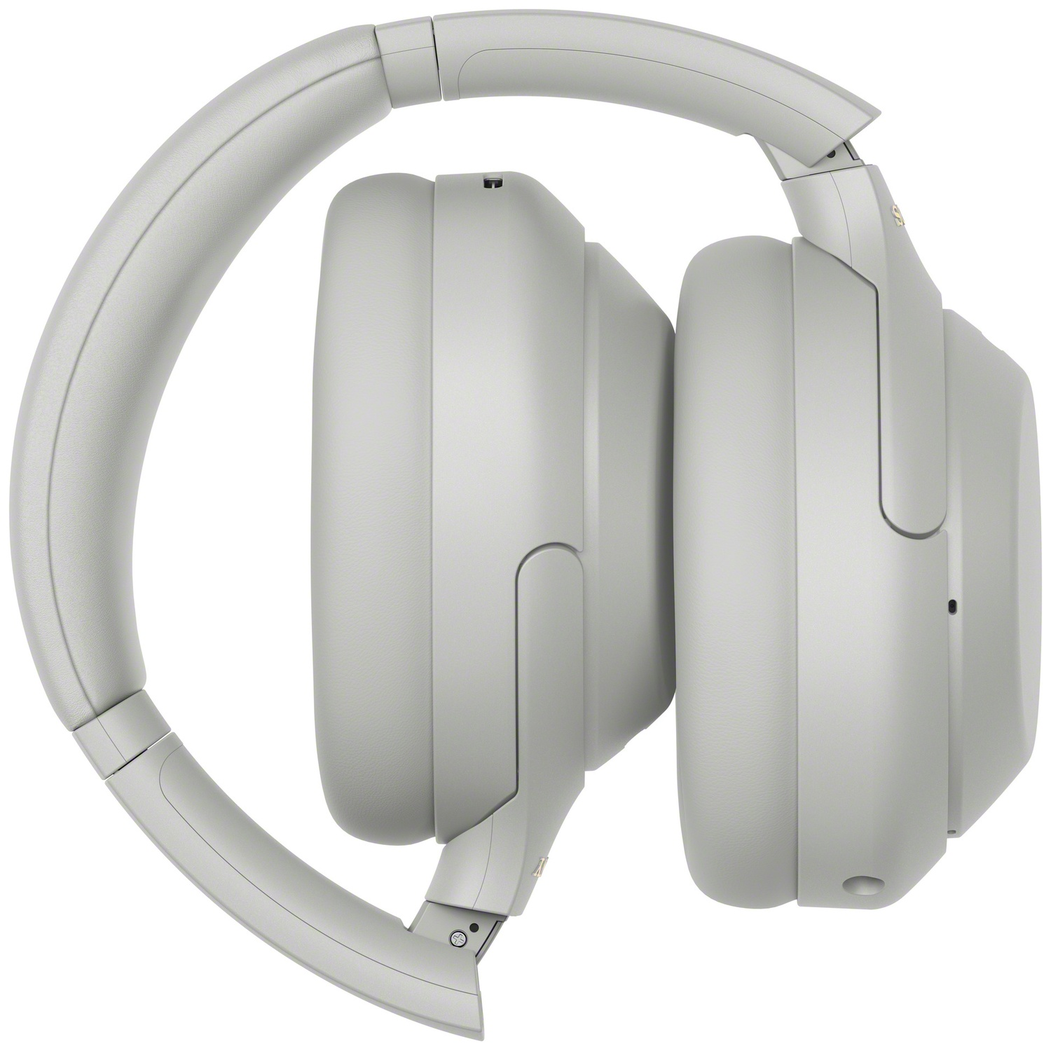 Casque supra-auriculaire gris de profil, oreillettes repliées et côte à côte sur fond blanc.