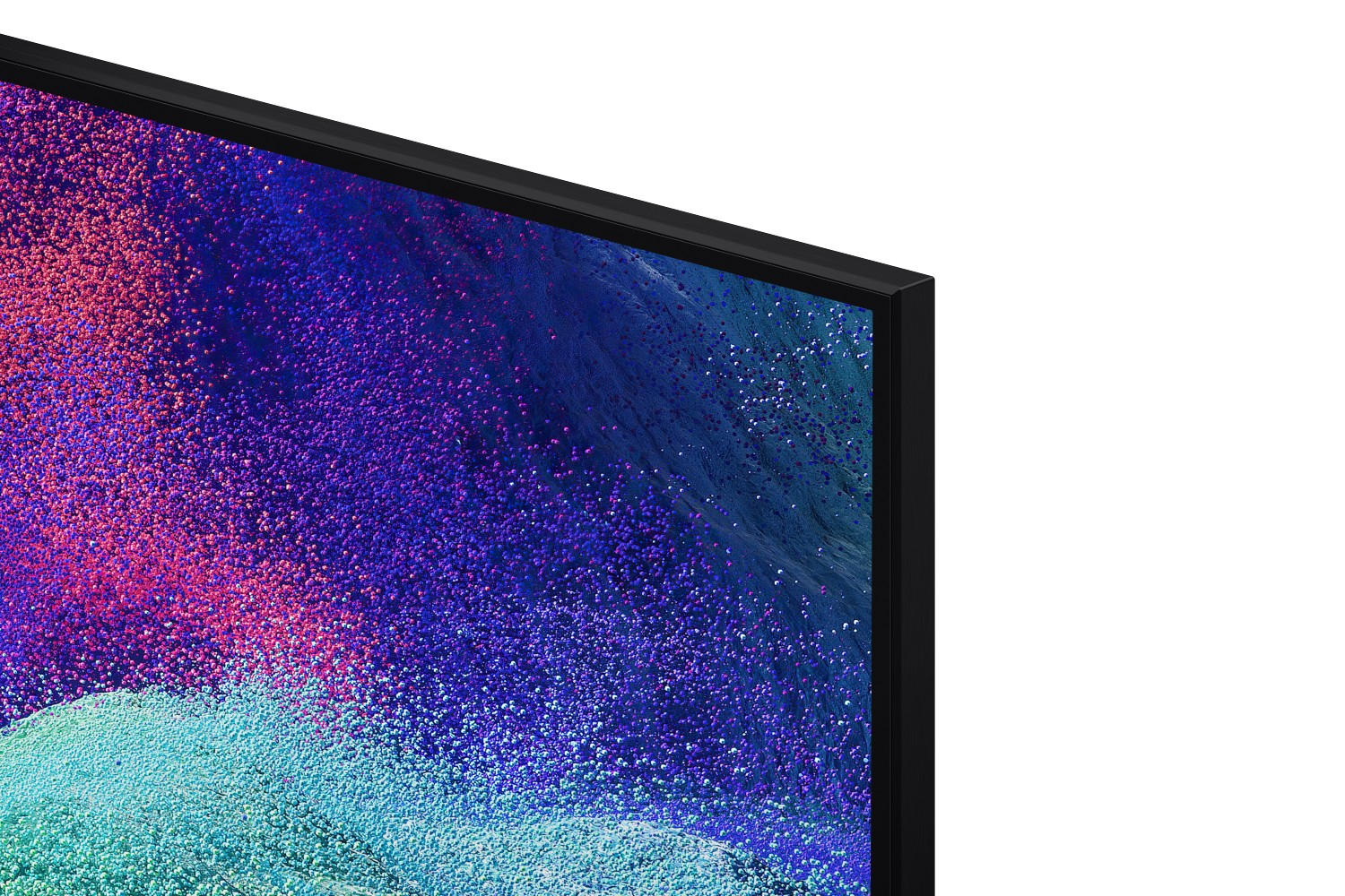 Primer plano de la esquina de un televisor con un patrón abstracto de partículas coloridas en la pantalla.