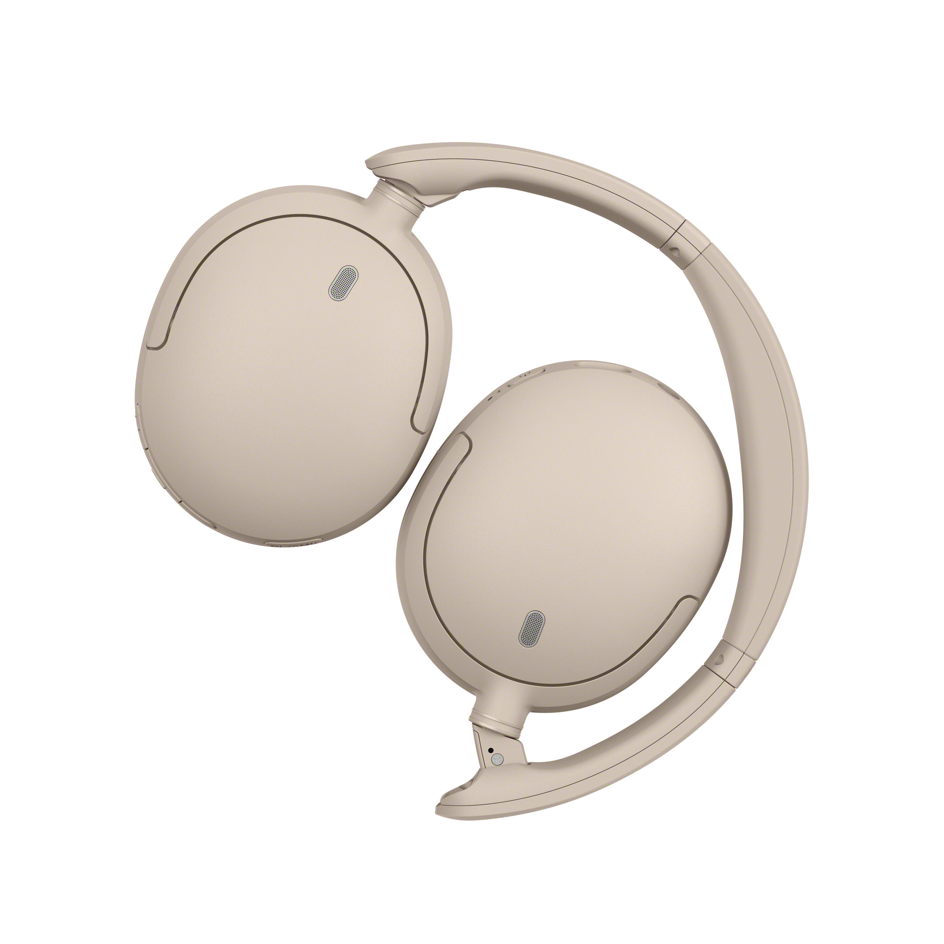Auriculares supraaurales plegables en color beige sobre fondo blanco.
