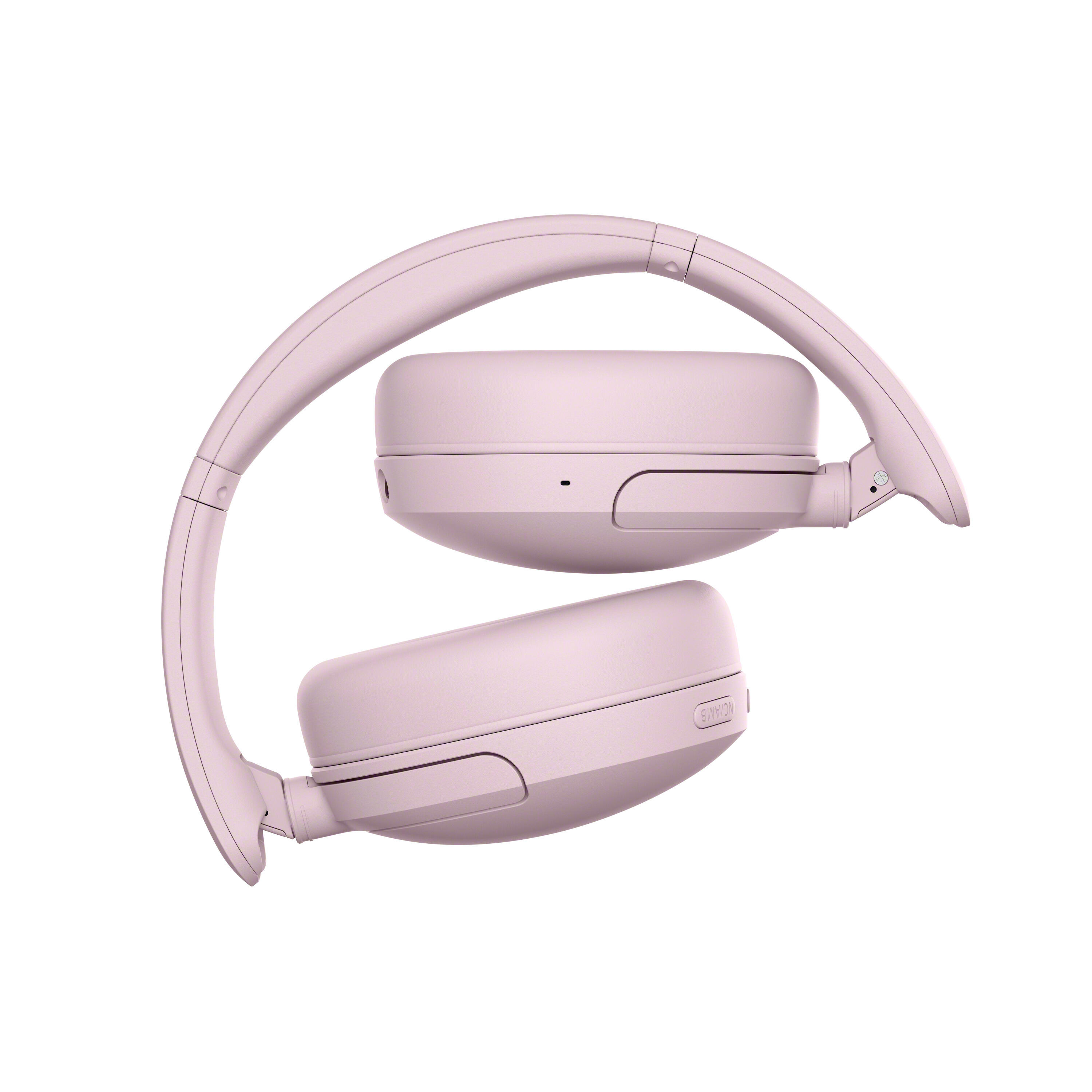 Auriculares supraaurales inalámbricos rosas plegados sobre fondo blanco.